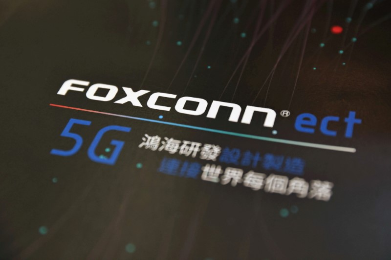 A poster with a logo of Foxconn is seen at the IEEE Global Communications Conference in Taipei