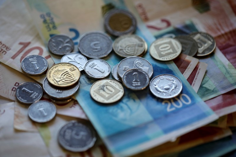 New Israeli Shekel banknotes and coins are seen in this picture illustration