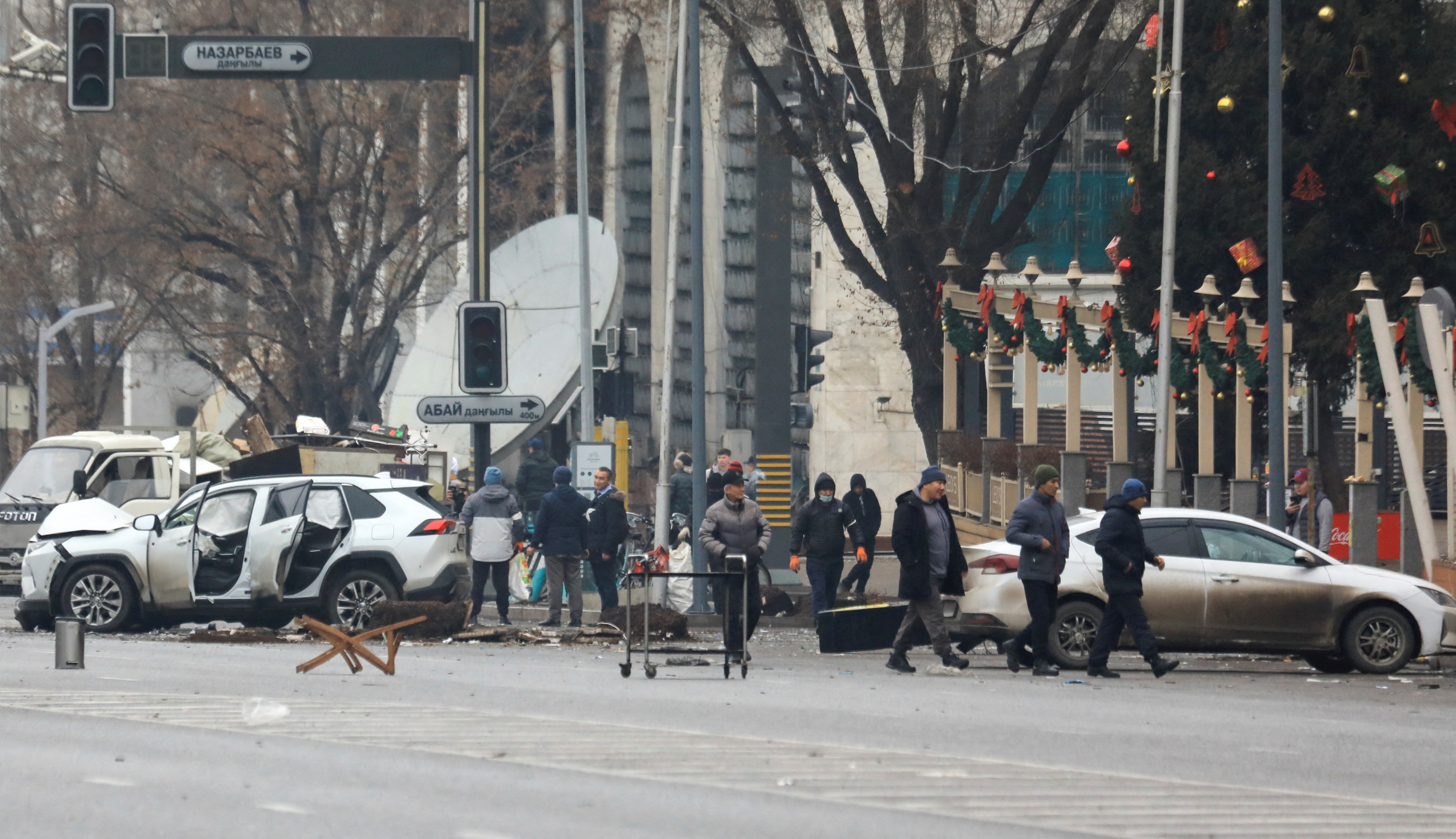 A car, which was damaged during the protests triggered by fuel price increase, is seen on a road in central Almaty, Kazakhstan January 7, 2022. REUTERS/Pavel Mikheyev