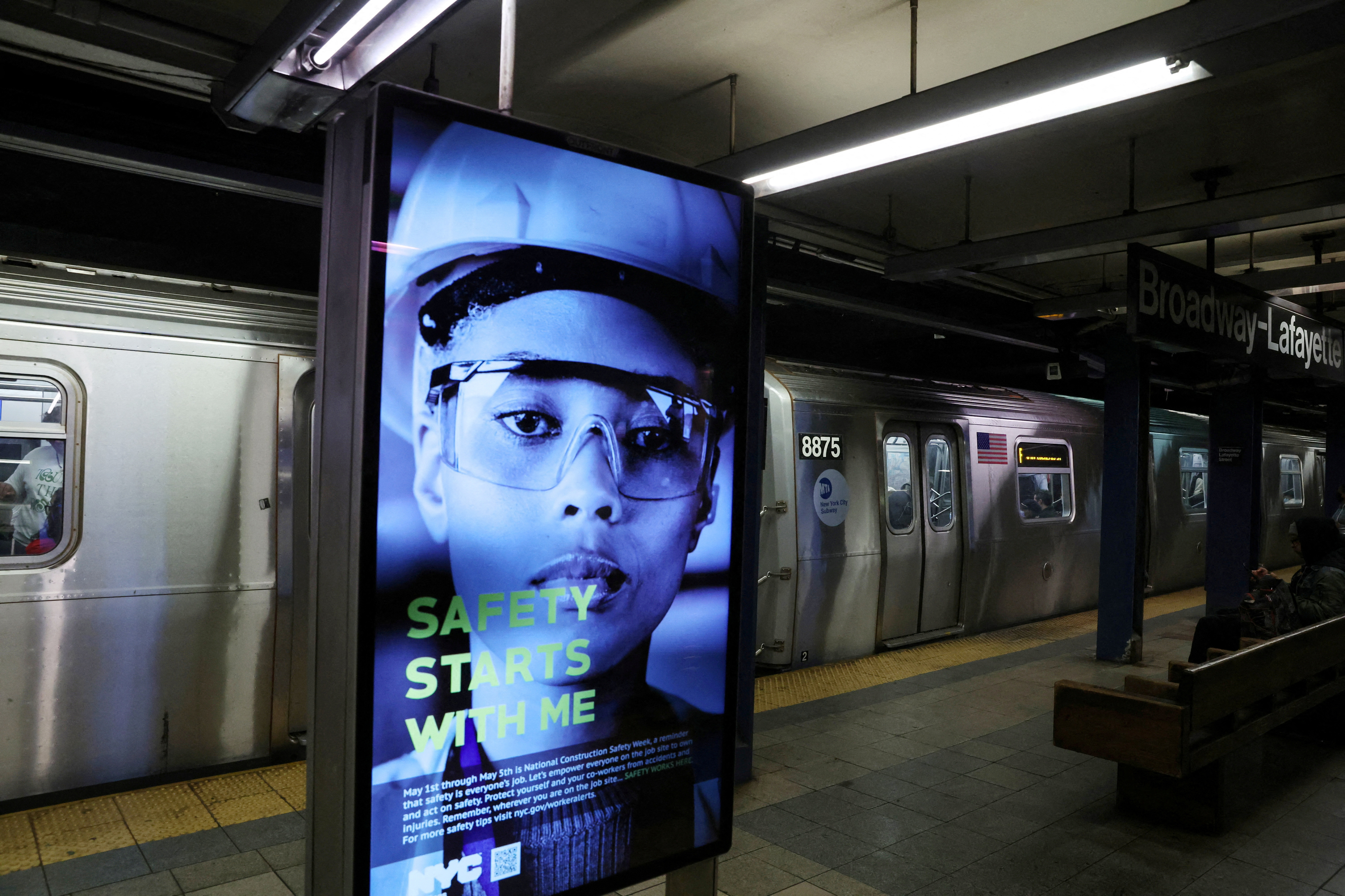 A digital public safety notice illuminates near where Jordan Neely was placed in a chokehold by a fellow passenger on a New York City subway train