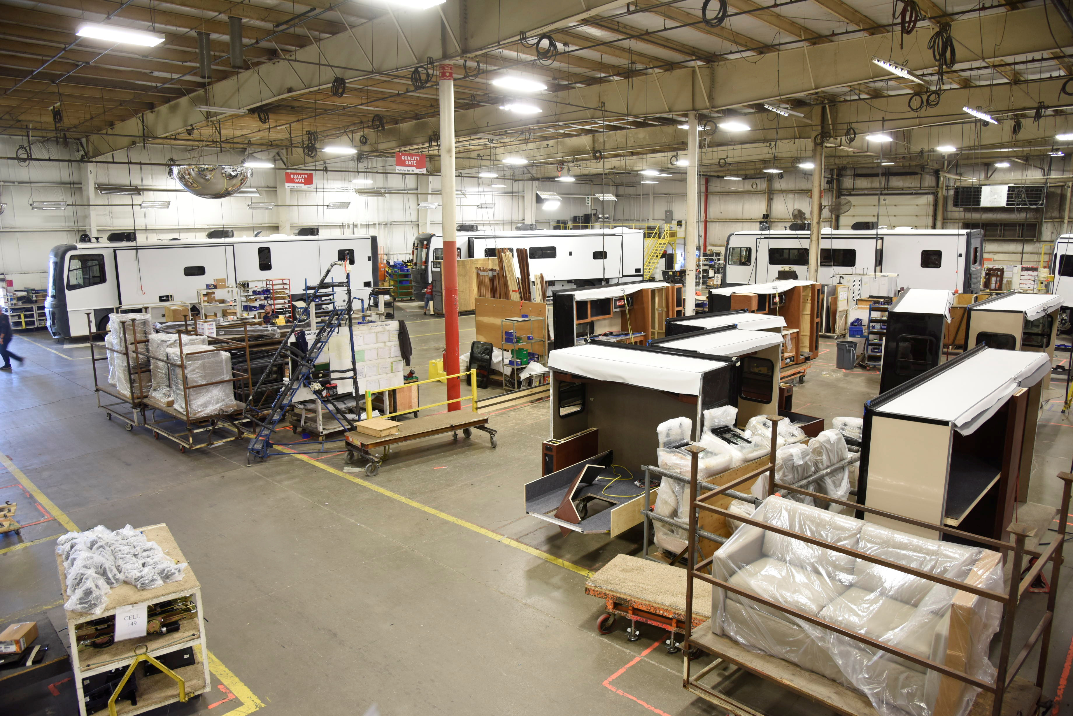 Employees work at a REV plant where they produce recreational vehicles in Decatur, Indiana, U.S., November 10, 2016. Picture taken November 10, 2016. REV Group/Handout via REUTERS 