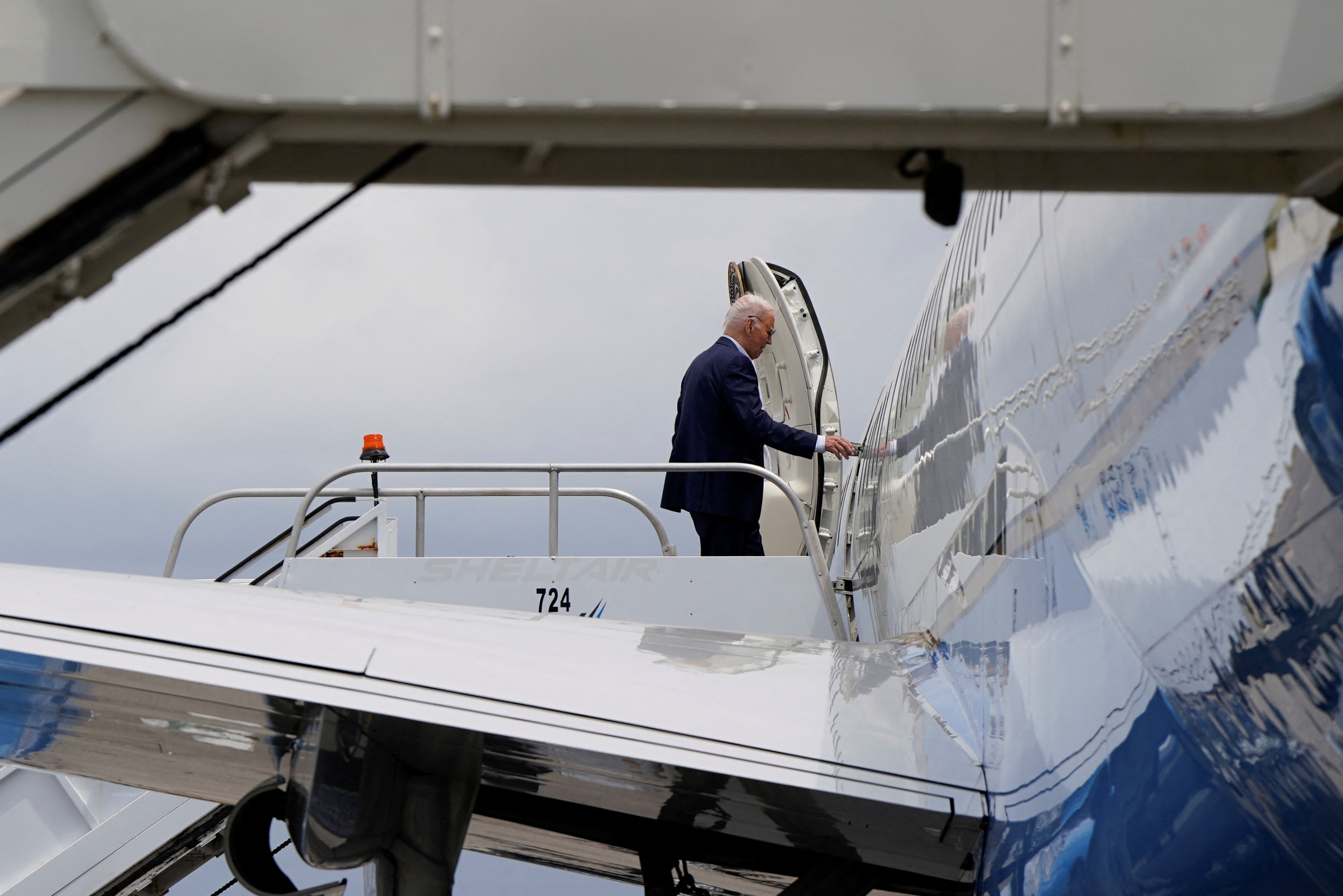 U.S. President Joe Biden boards Air Force One en route to multiple campaign receptions from LaGuardia International Airport in New York