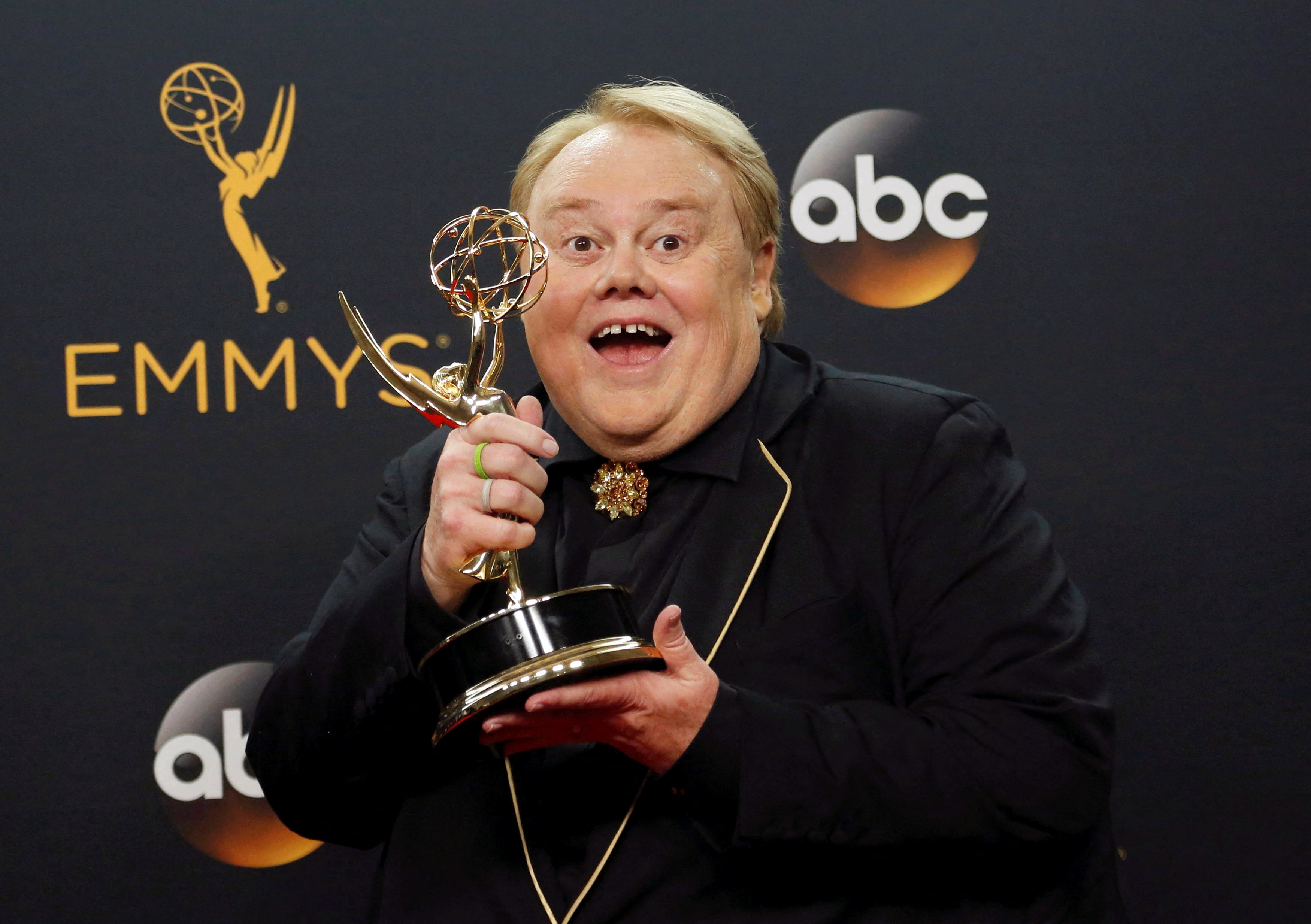 Actor Louie Anderson poses backstage with his award for Best Supporting Actor in a Comedy Series for his role on the FX series 