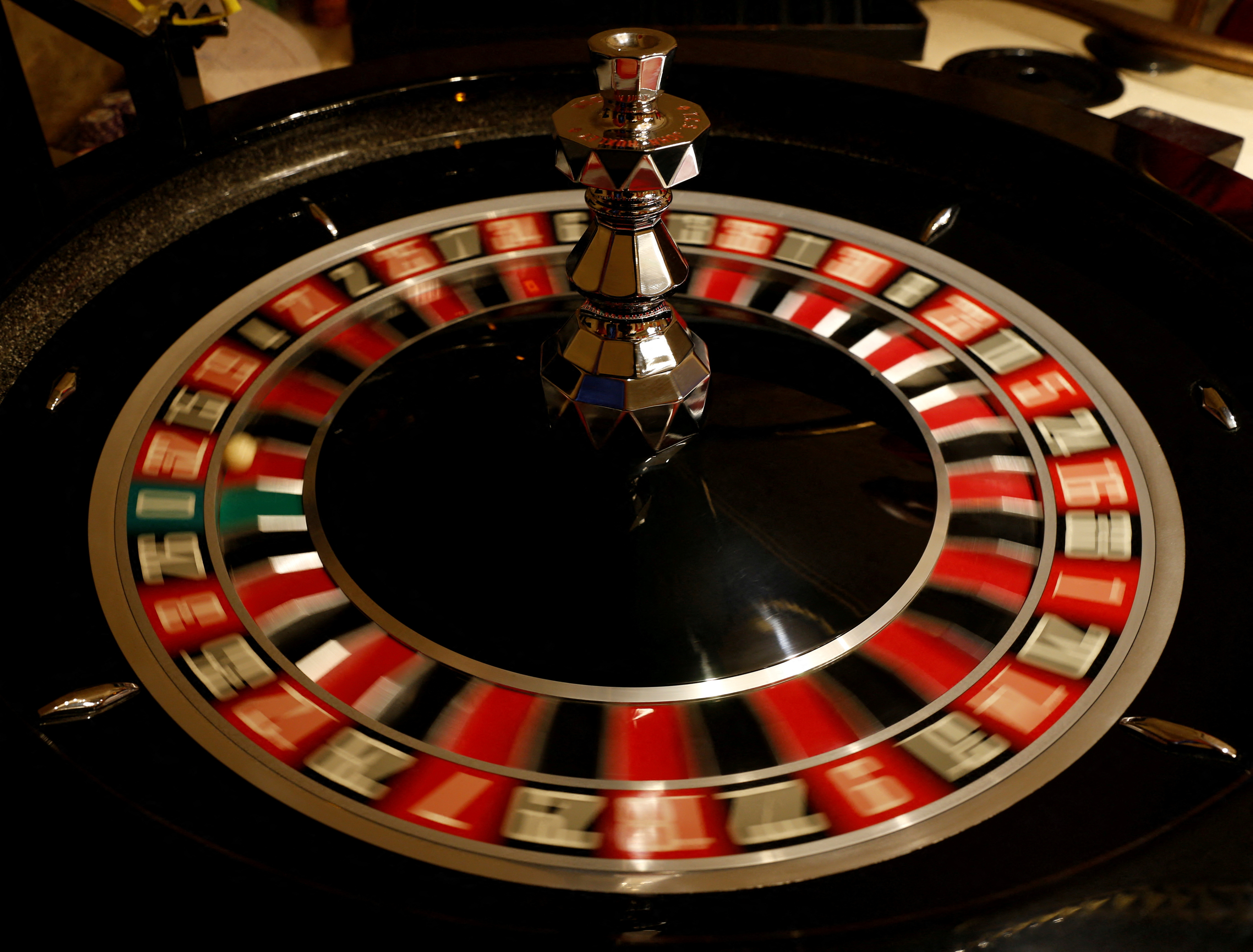 The spinning wheel on a Roulette table is seen at the Dragonara Casino in St Julian's
