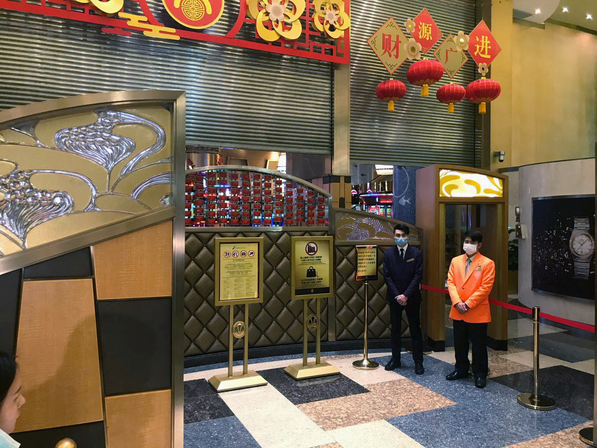 Shutters are being opened at the Grand Lisboa Casino after gambling recommenced at midnight, in Macau