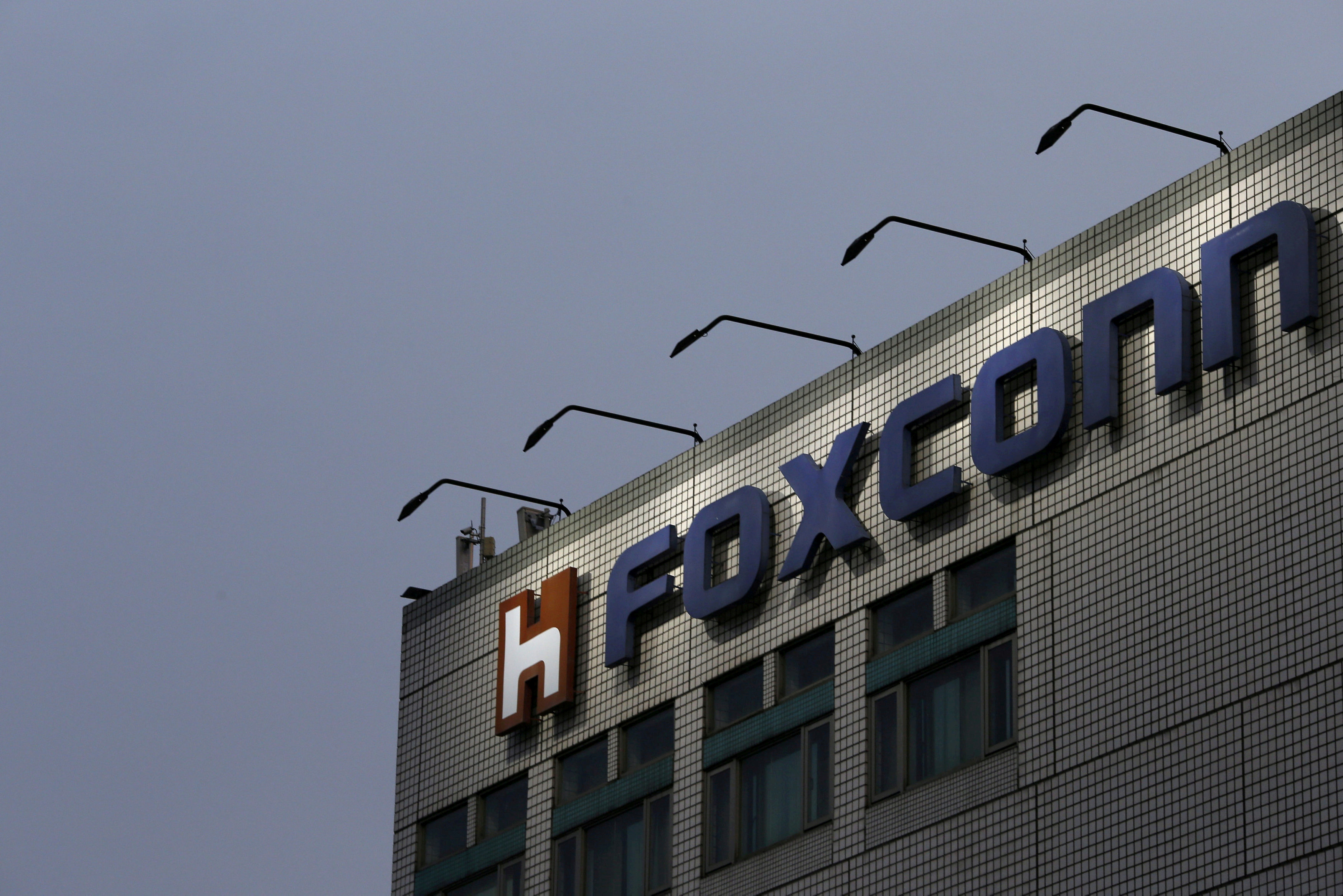 The logo of Foxconn, the trading name of Hon Hai Precision Industry, is seen on top of the company's headquarters in New Taipei City, Taiwan