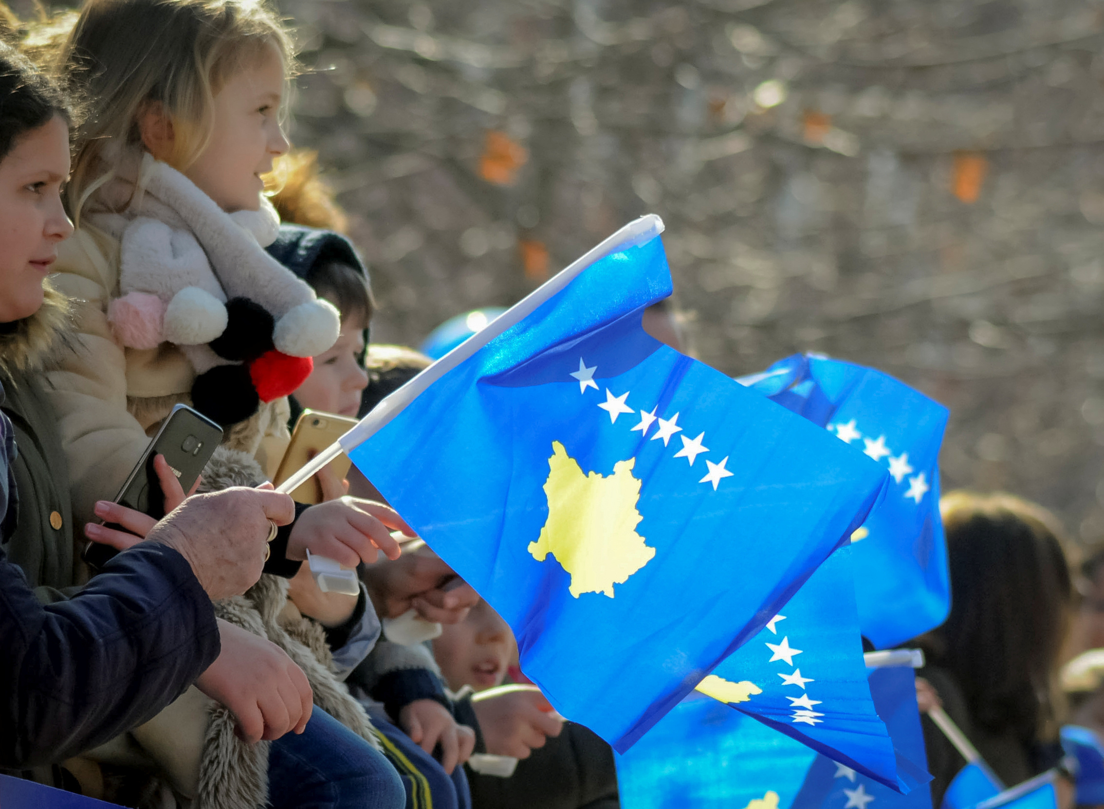 People attend celebrations of the 11th anniversary of Kosovo independence in Pristina