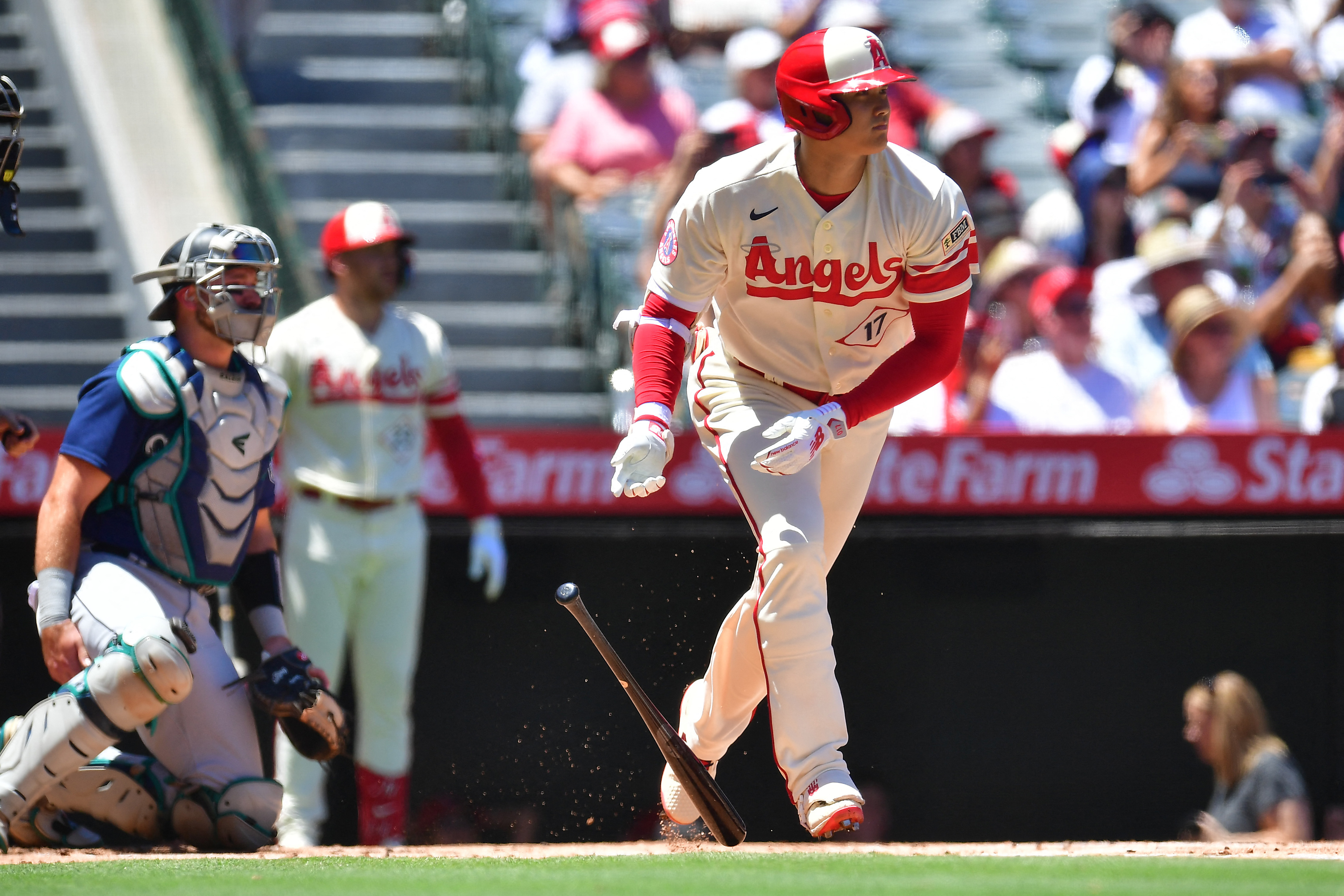 Seattle Mariners' Eugenio Suarez holds a trident while celebrating his home  run with Julio Rodriguez, right, in a baseball game against the Los Angeles  Angels, Tuesday, Sept. 12, 2023, in Seattle. (AP