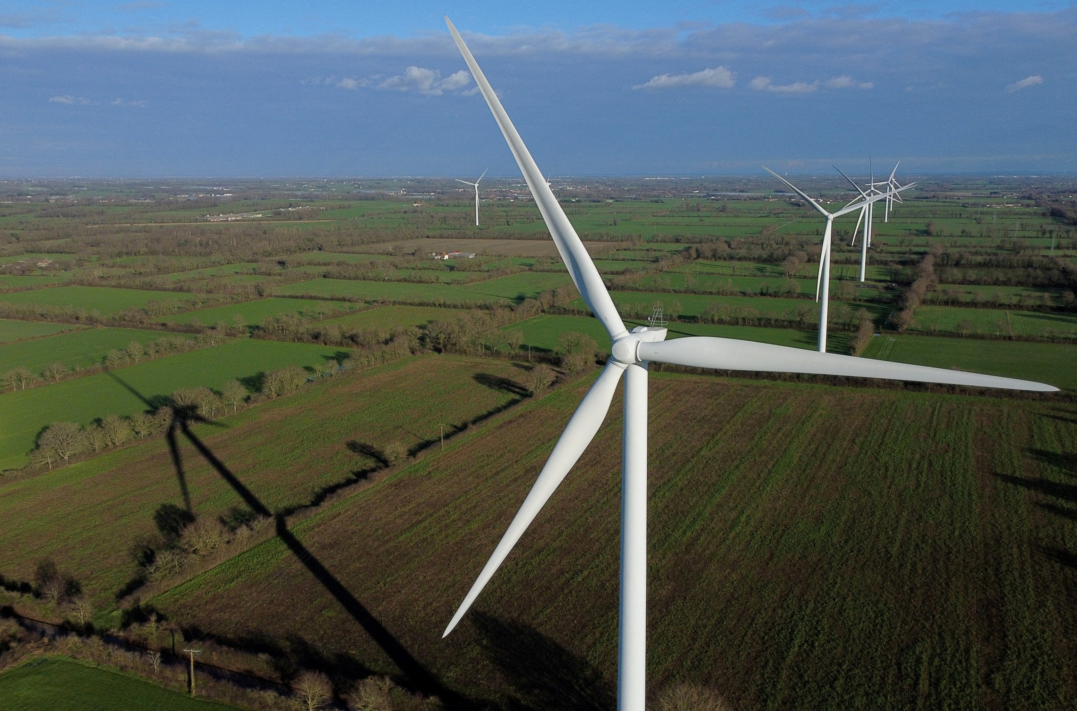 Power-generating windmill turbines at a wind park in Saint-Philbert-de-Bouaine