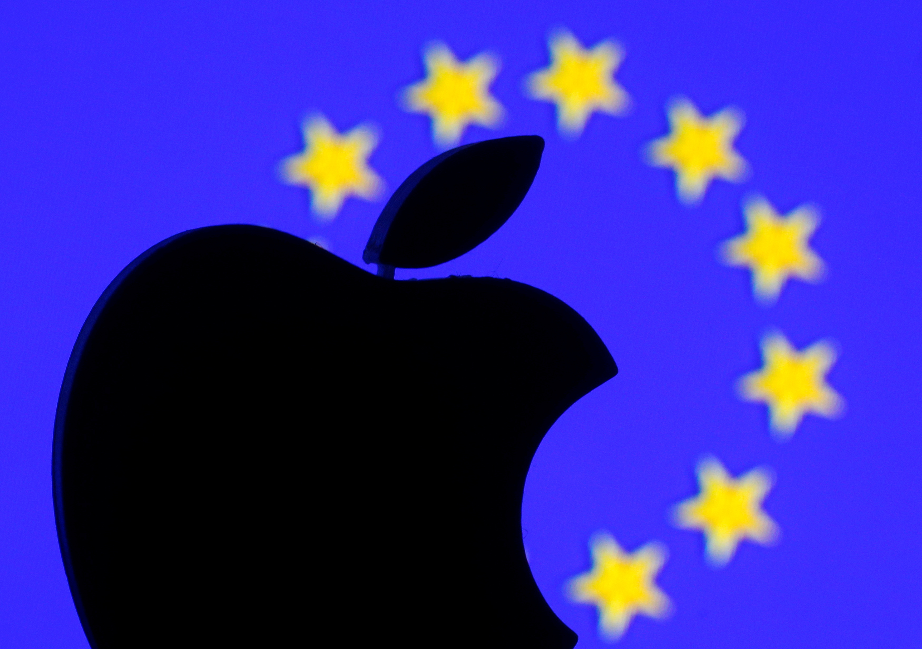 A 3D-printed Apple logo is seen in front of a displayed European Union flag in this illustration