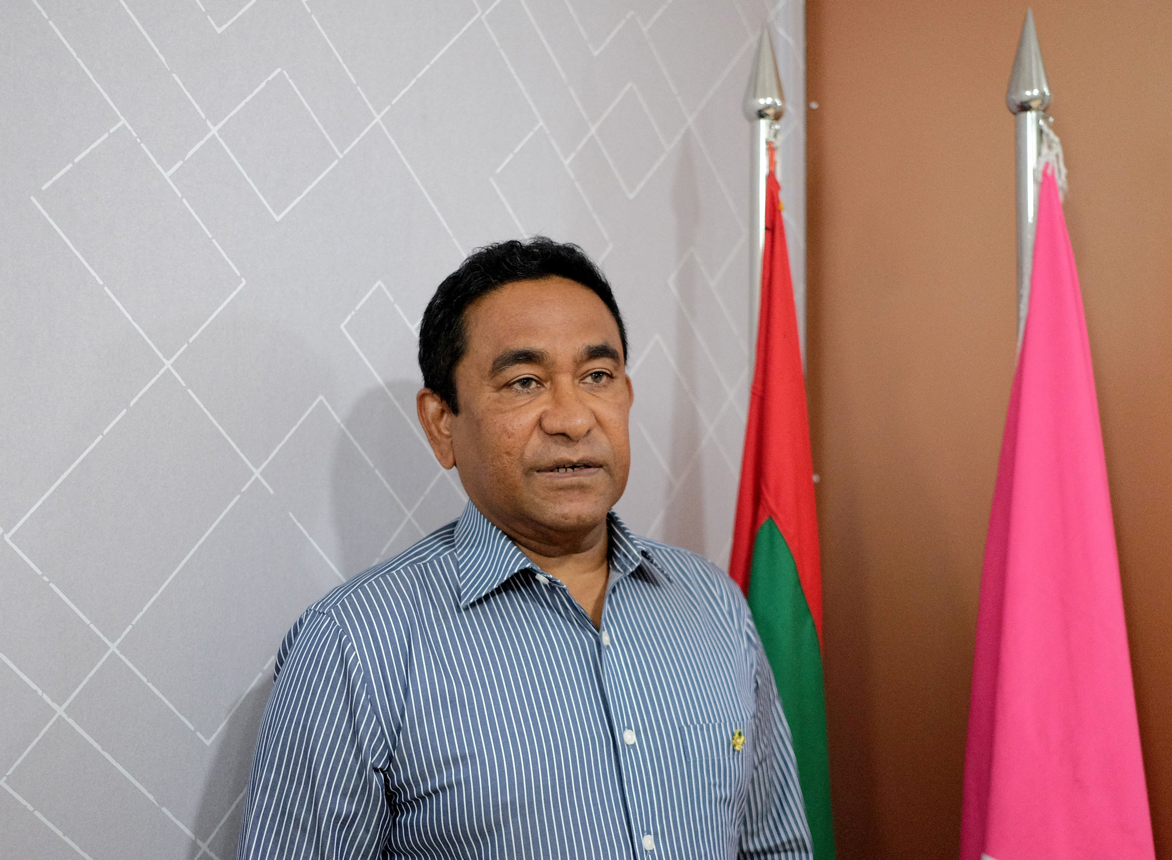 Abdulla Yameen poses for a photo at his party office in Male