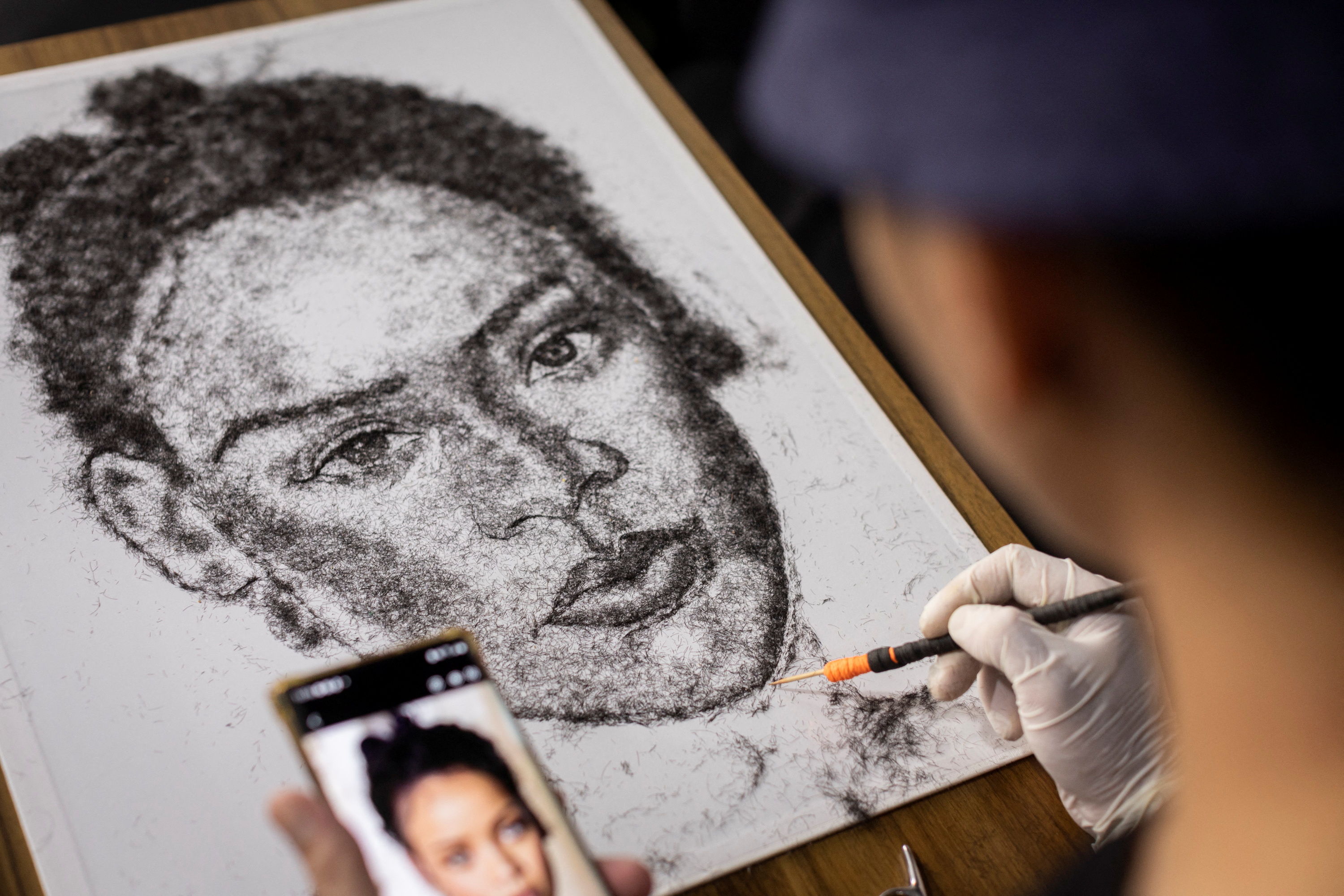 A hairy idea: Filipino artist uses own hair to create portraits