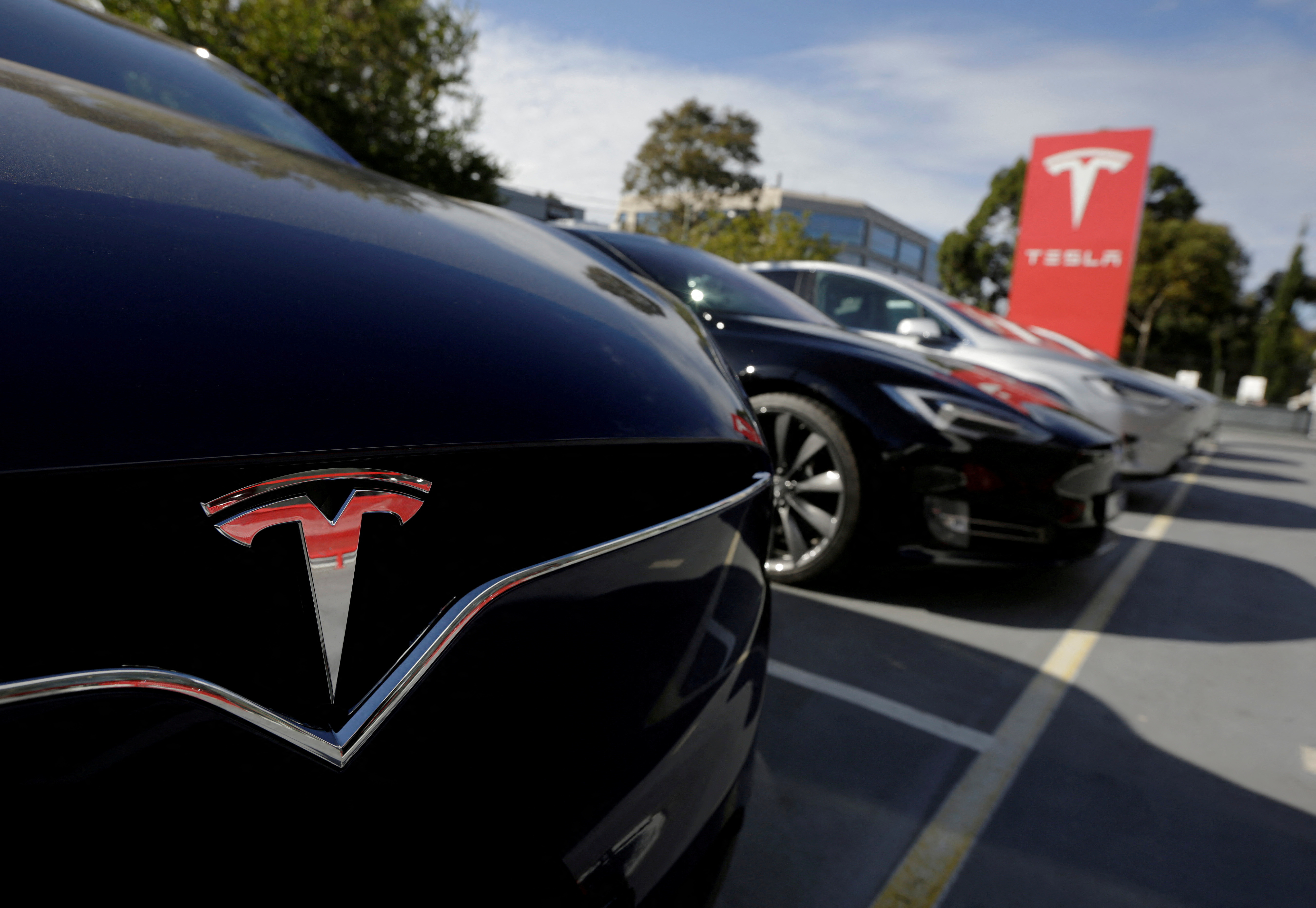 A Tesla Model X is photographed alongside a Model S at a Tesla electric car dealership in Sydney