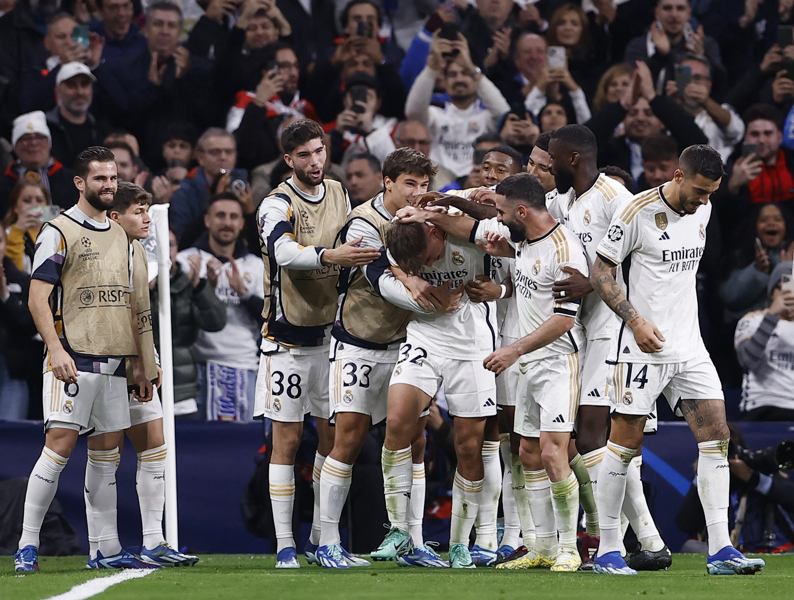 Real Madrid secure top spot after recovering to beat Napoli 4-2