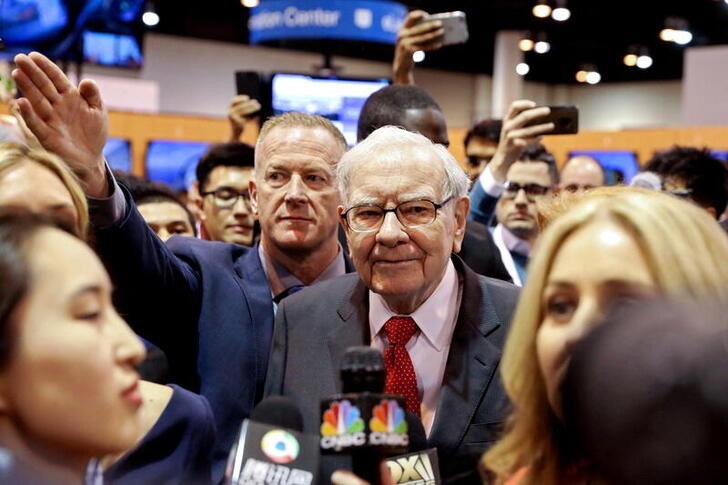 Berkshire Hathaway Chairman Warren Buffett walks through the exhibit hall as shareholders gather to hear from the billionaire investor at Berkshire Hathaway Inc's annual shareholder meeting in Omaha