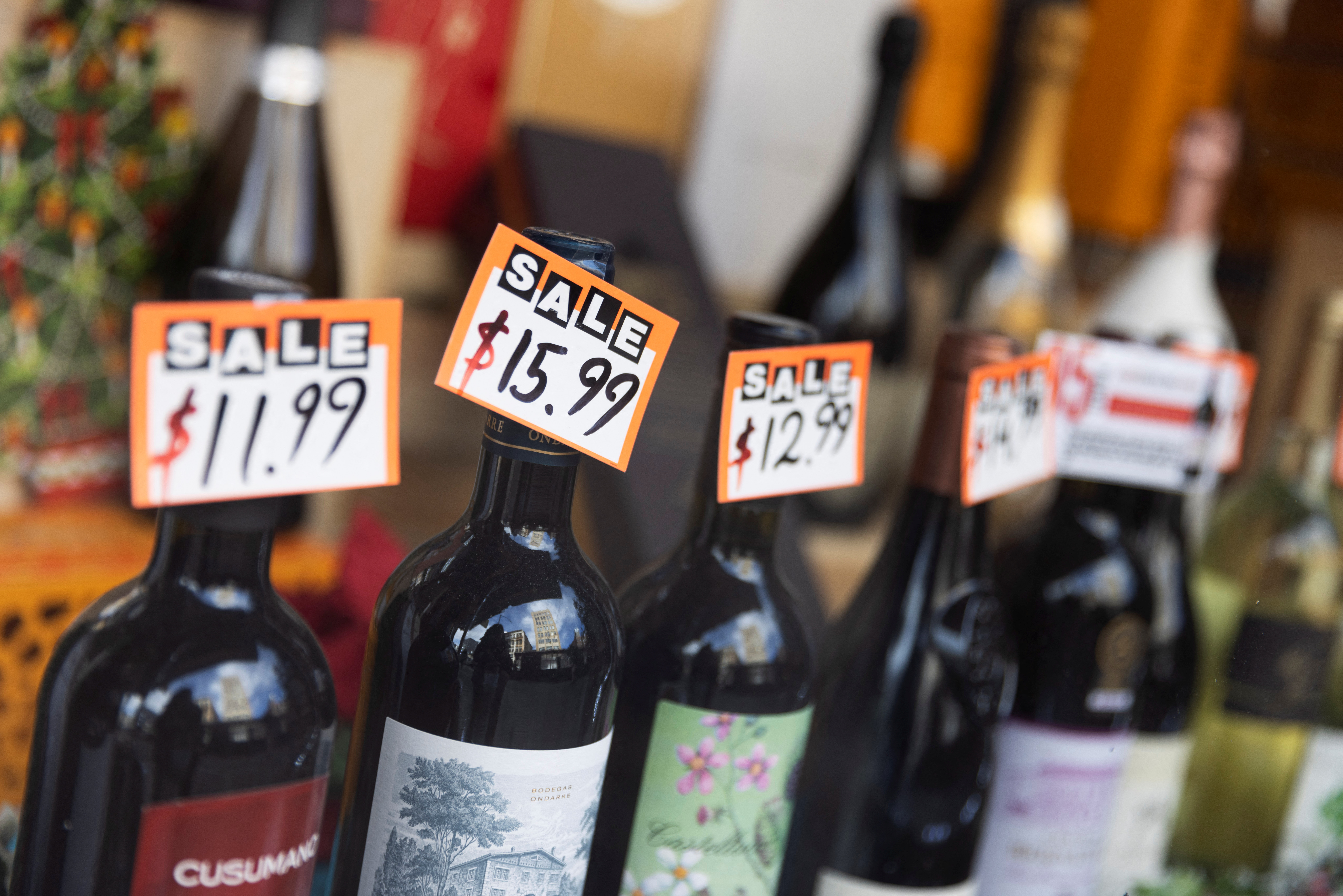 Prices are seen on wine bottles displayed in a store in Manhattan, New York City