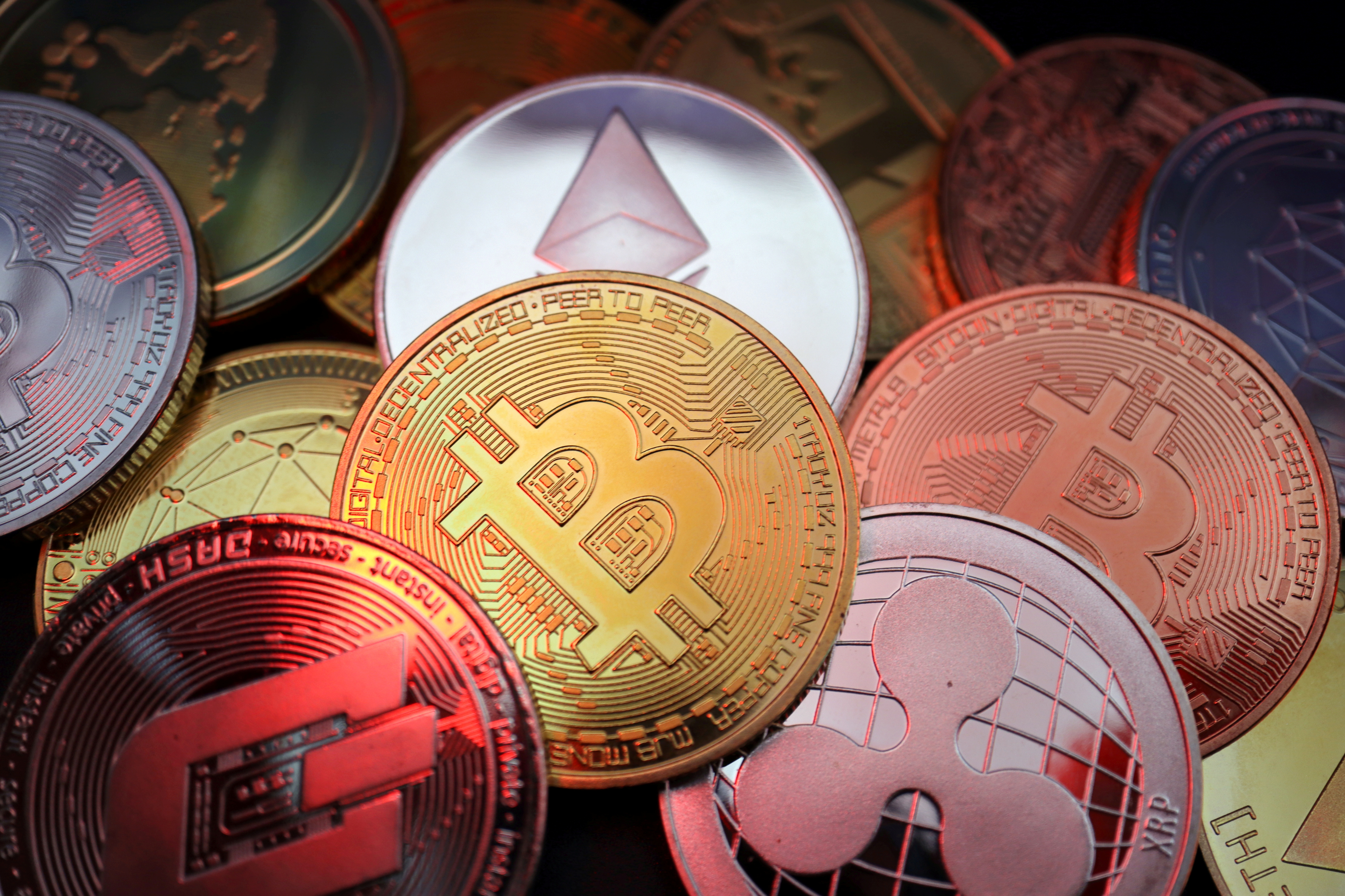  Representations of cryptocurrencies including Bitcoin, Dash, Ethereum, Ripple and Litecoin are seen in this illustration picture taken June 2, 2021. REUTERS/Florence Lo/Illustration/File Photo