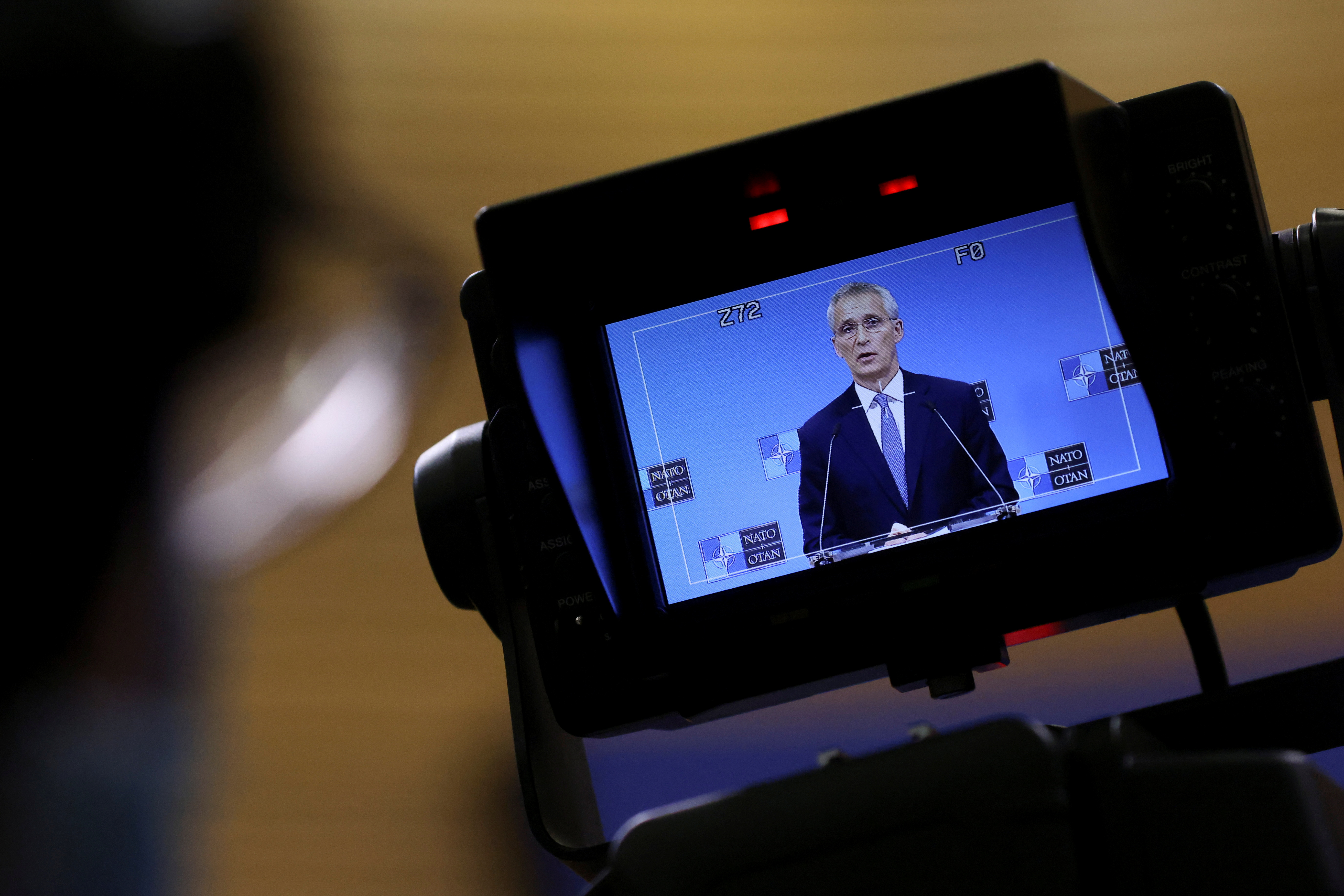 A member of the media records NATO Secretary General Jens Stoltenberg as he speaks during a news conference ahead of a meeting of NATO defence ministers at the alliance's headquarters in Brussels, Belgium October 20, 2021. REUTERS/Yves Herman