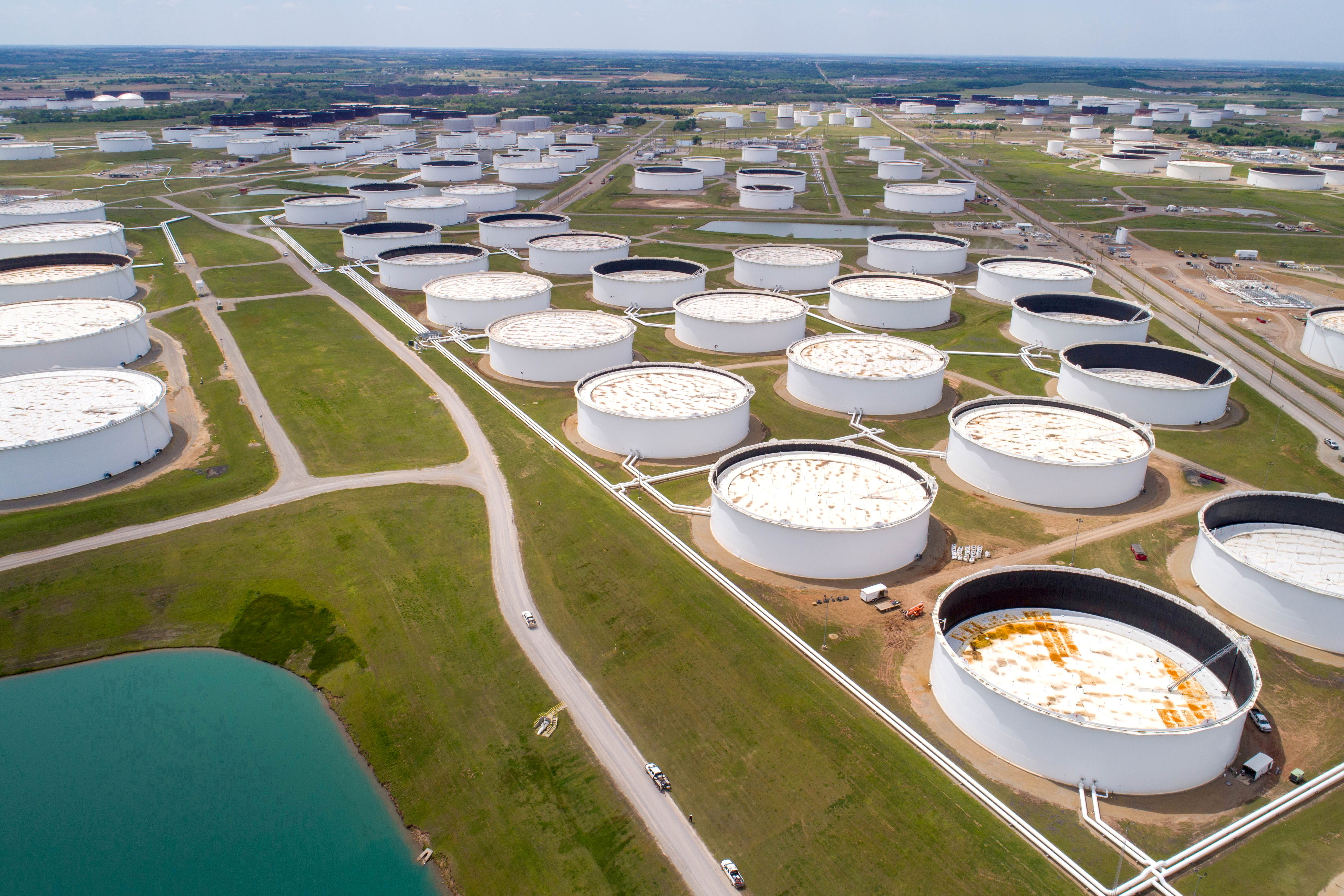Crude oil storage tanks are seen in an aerial photograph at the Cushing oil hub in Cushing, Oklahoma, U.S. April 21, 2020. REUTERS/Drone Base/File Photo