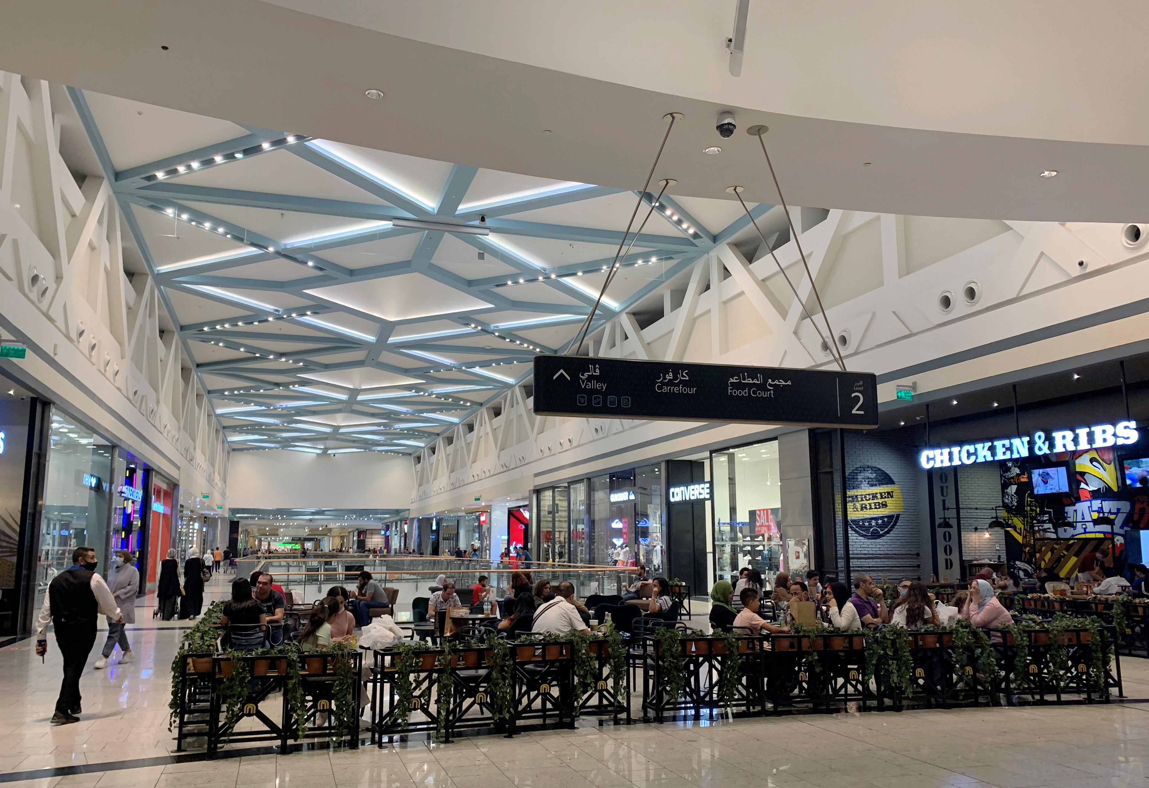 Customers shopping amid the coronavirus disease (COVID-19) pandemic sit at a food court at Mall of Egypt, known as 