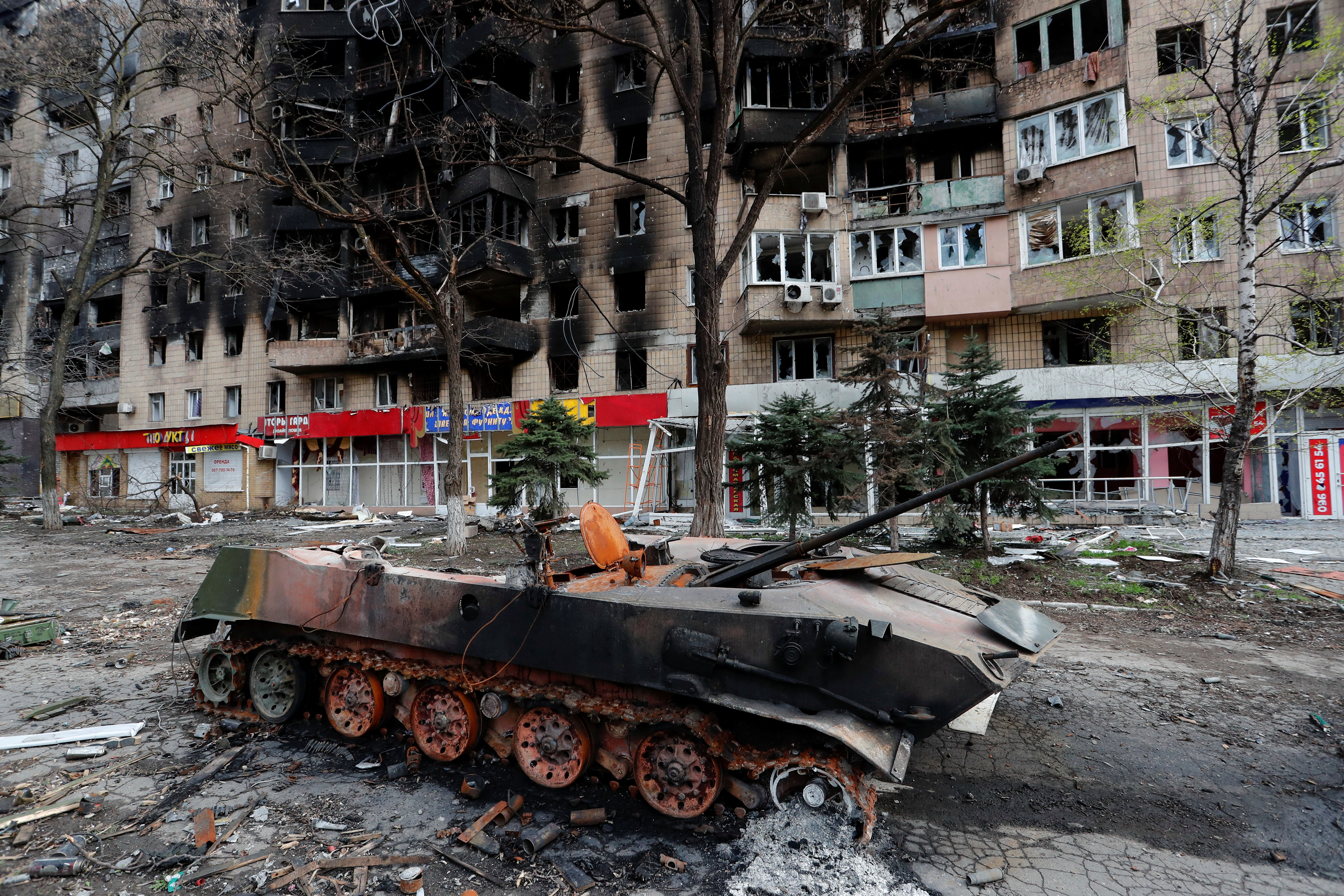 A view shows a destroyed armoured vehicle in Mariupol