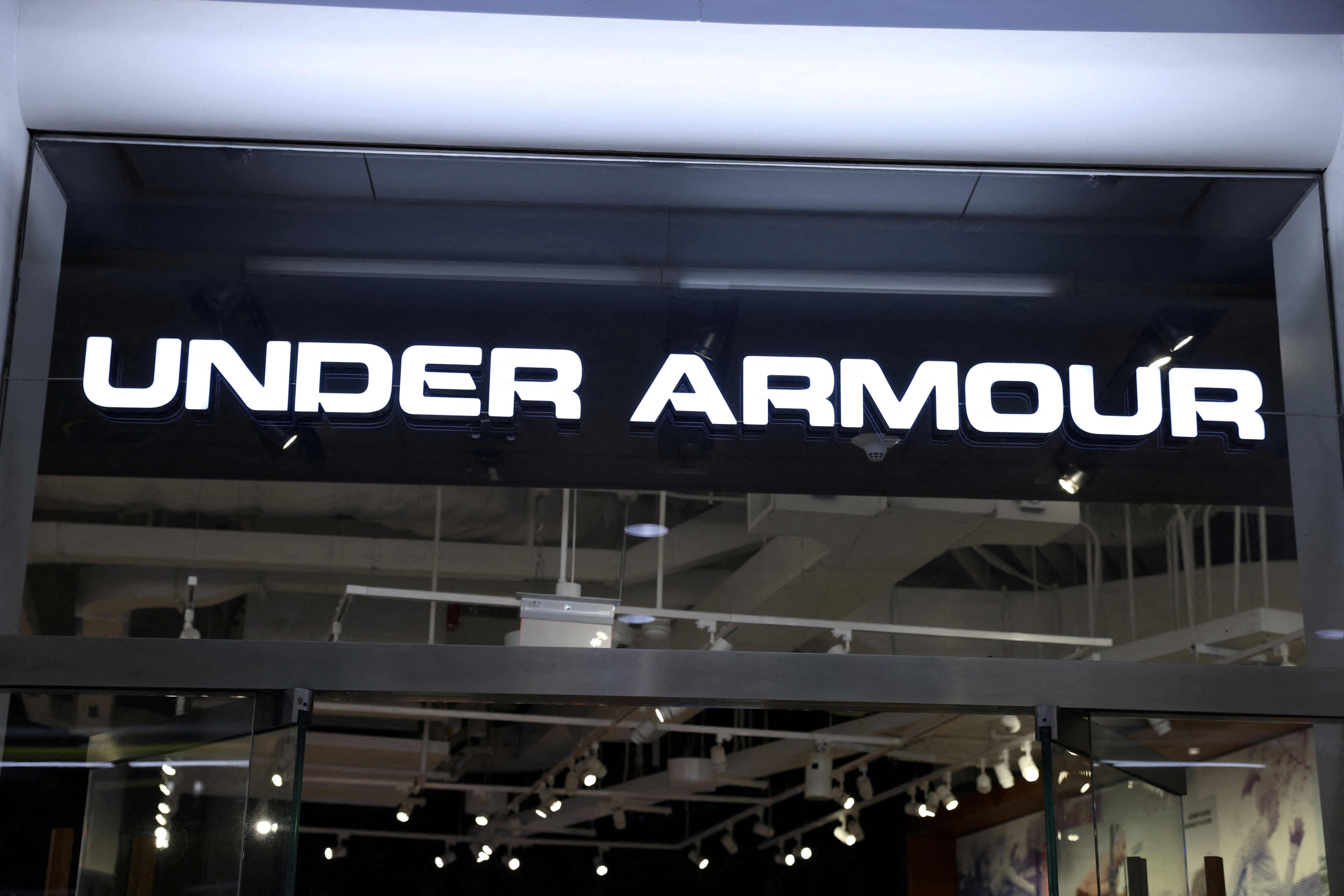 Under Armour warns of margin hit excess stock spurs discounts | Reuters