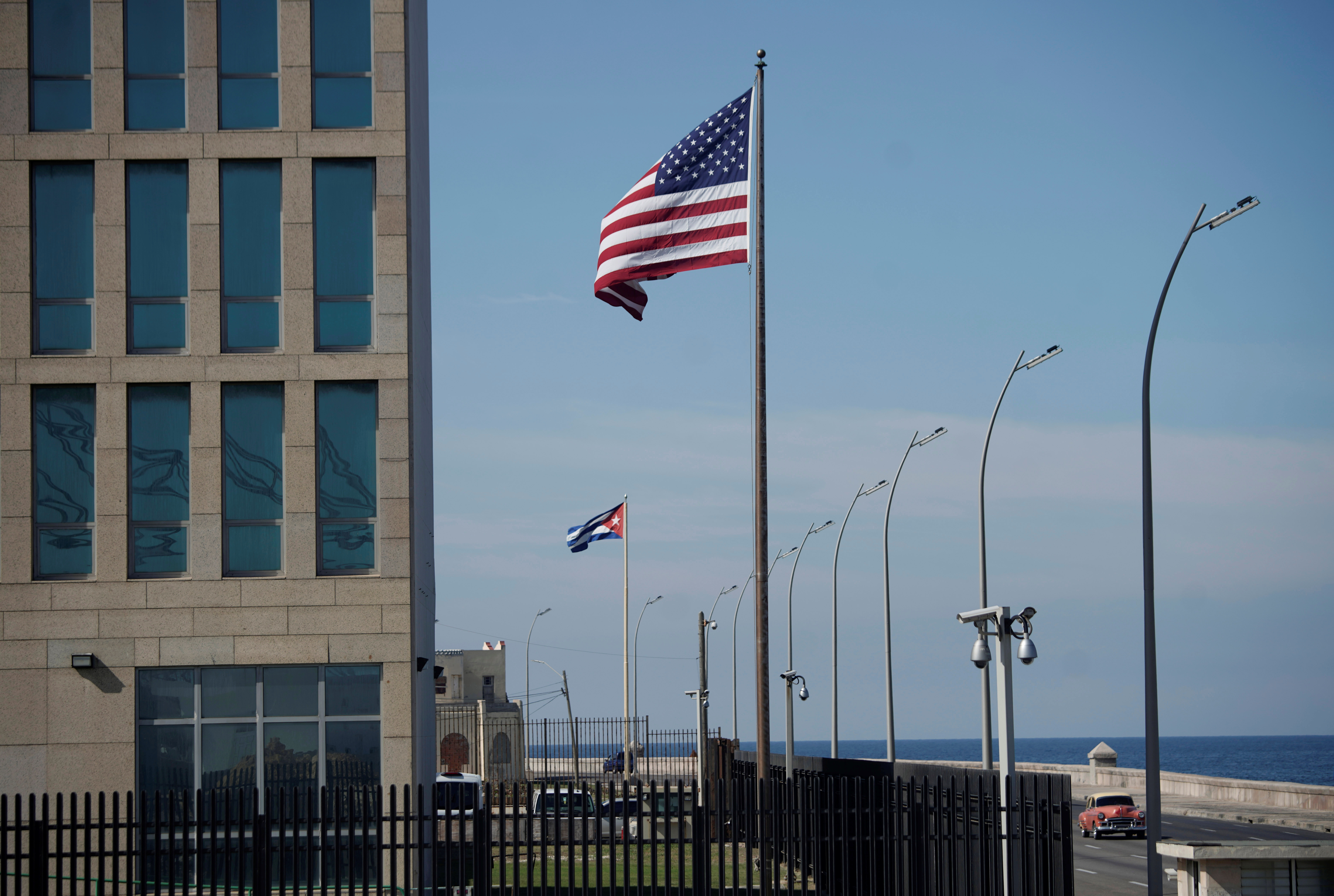 A view of Cuban and American flags beside the U.S. Embassy in Havana