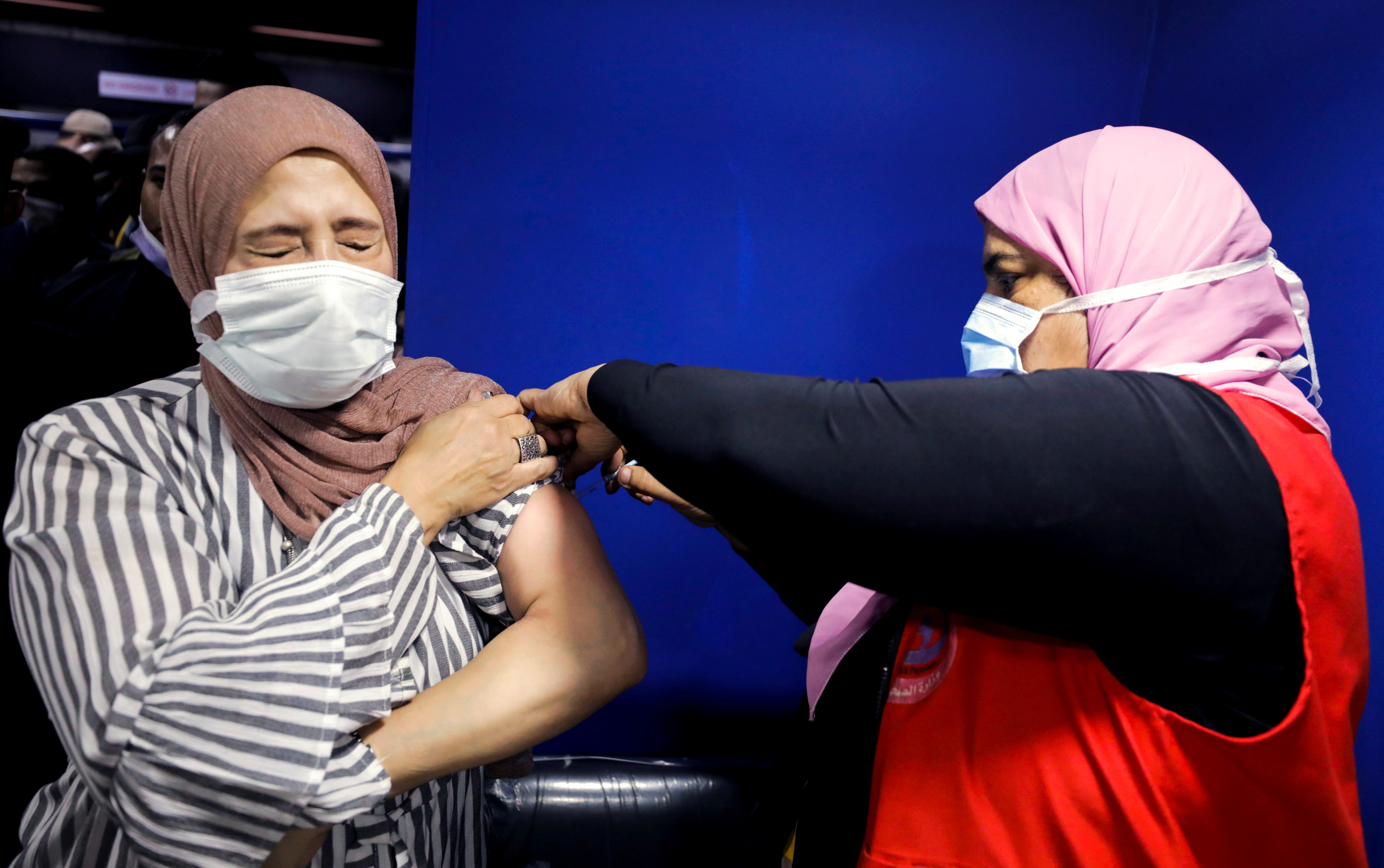 Woman receives a dose of the COVID-19 vaccine, in Cairo