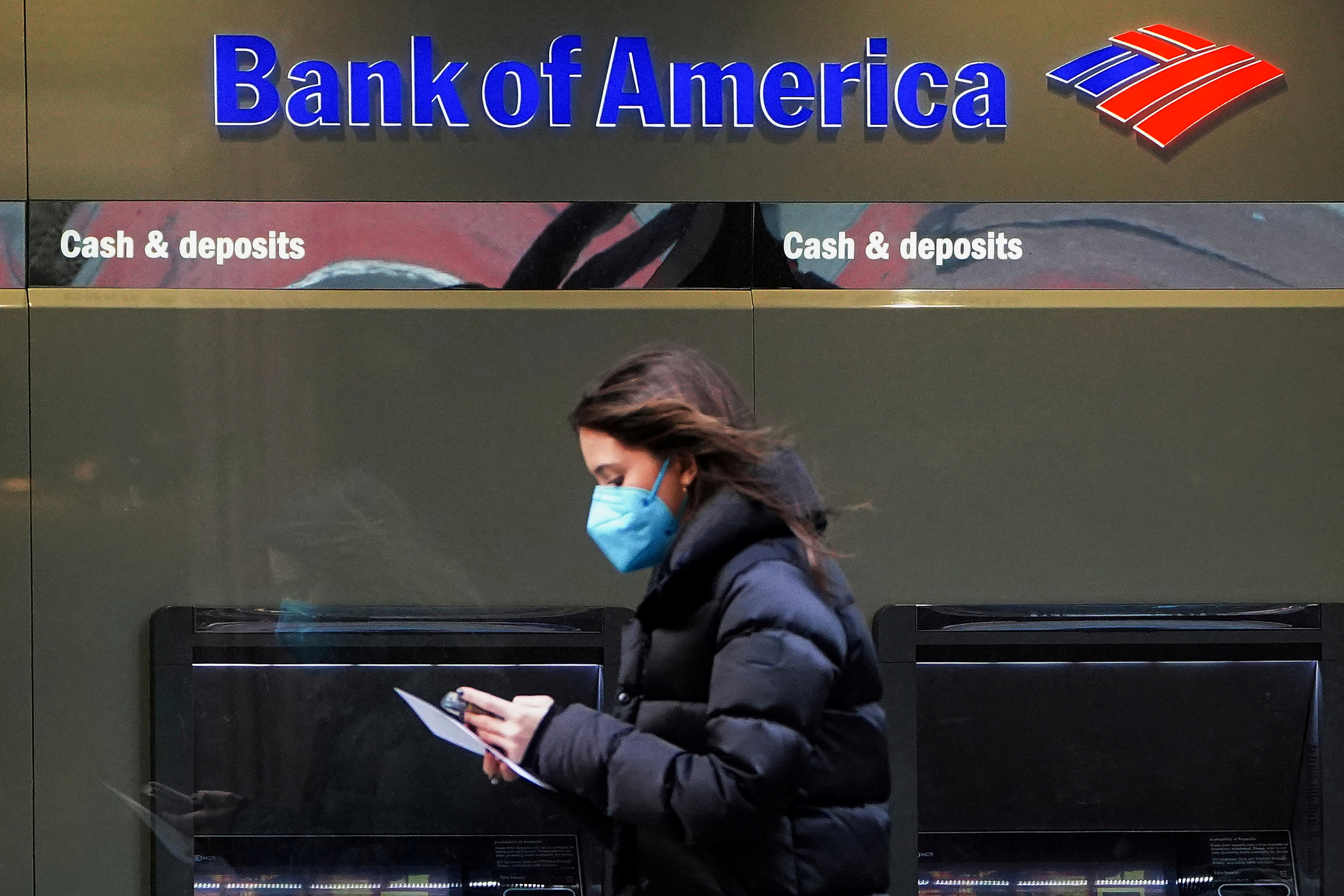 Person walks past a Bank of America sign in New York City