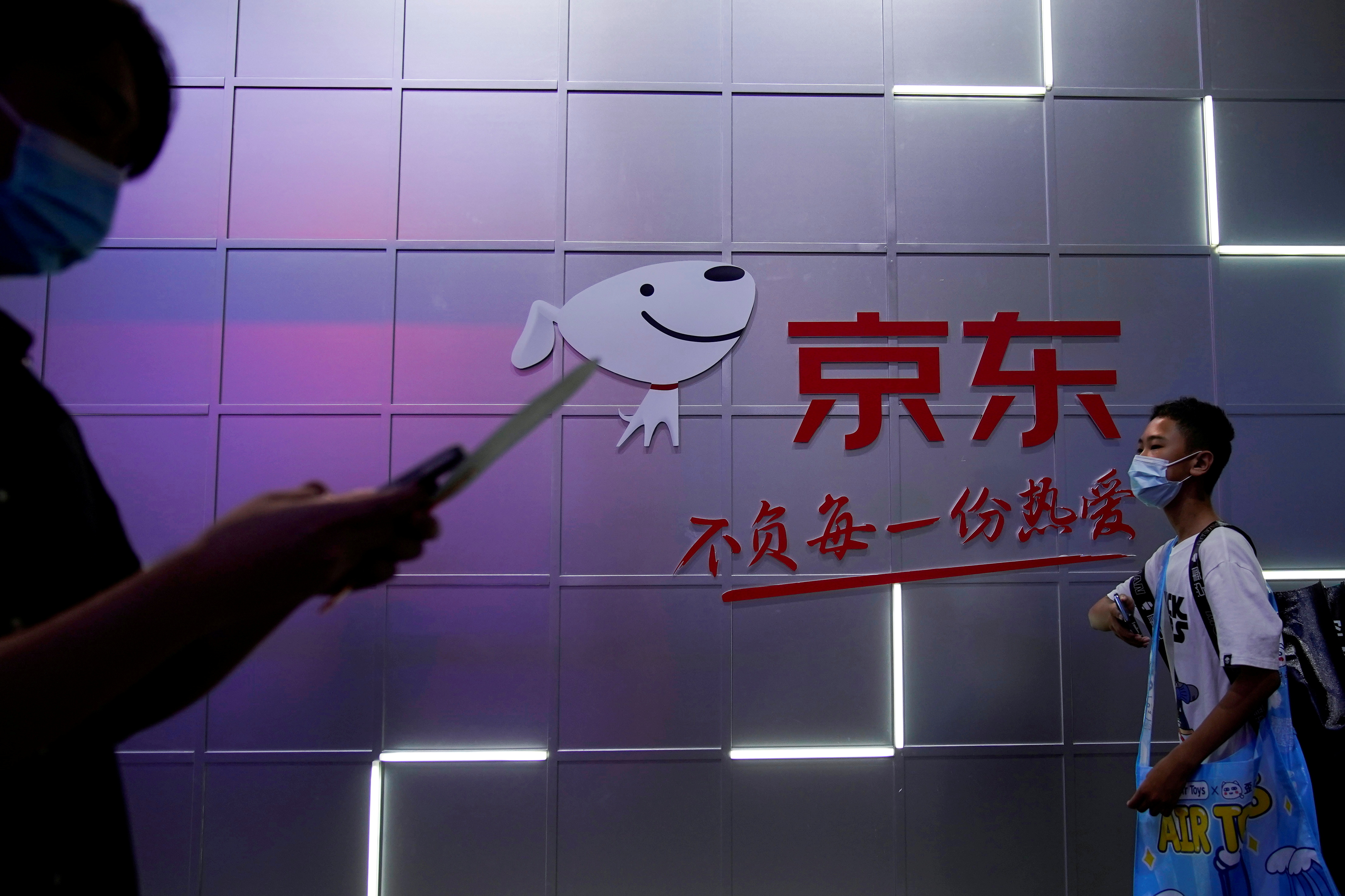 A sign of JD.com is seen at the China Digital Entertainment Expo and Conference, also known as ChinaJoy, in Shanghai