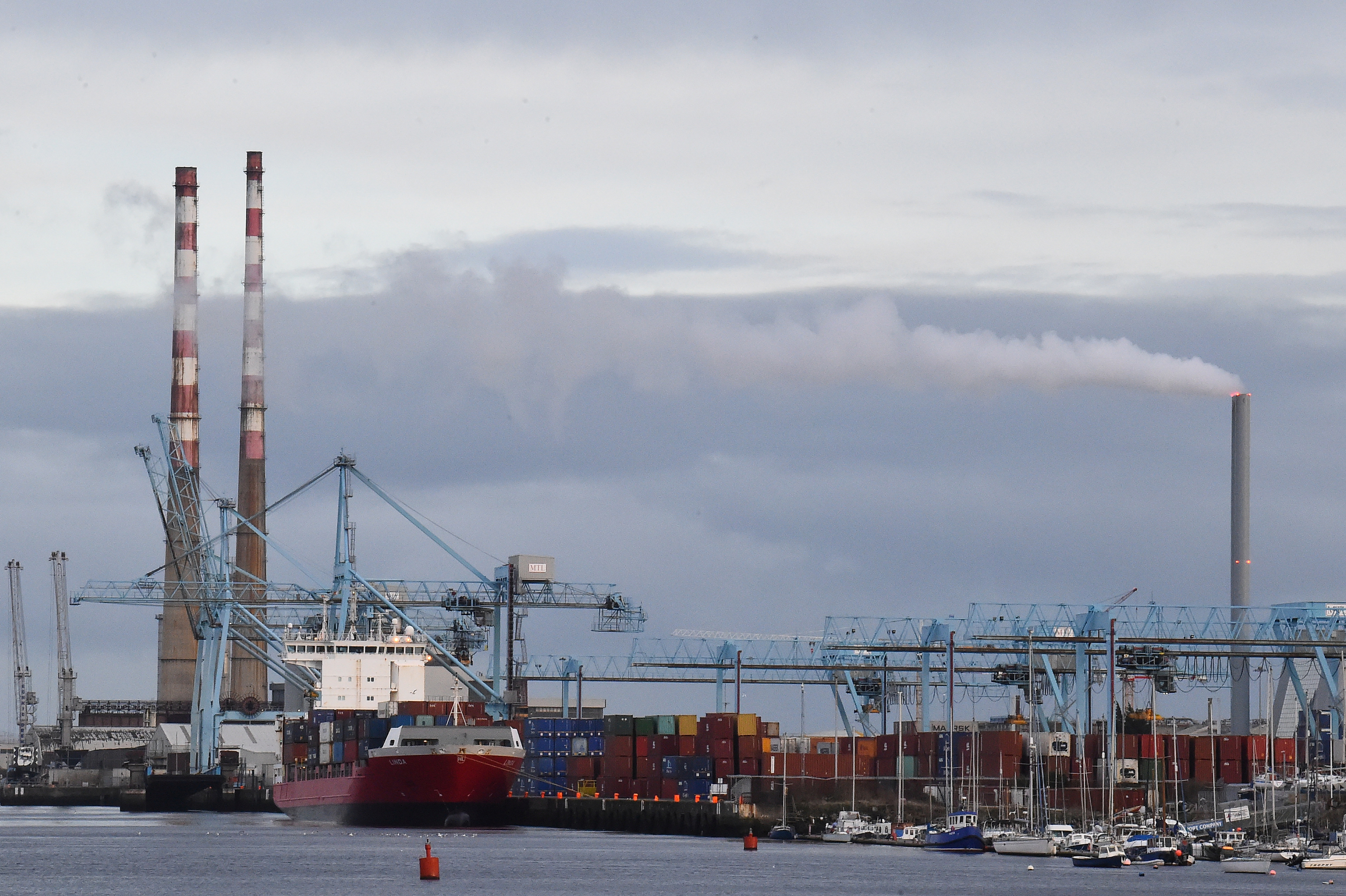 Cargo ship loading containers is seen at Dublin Port