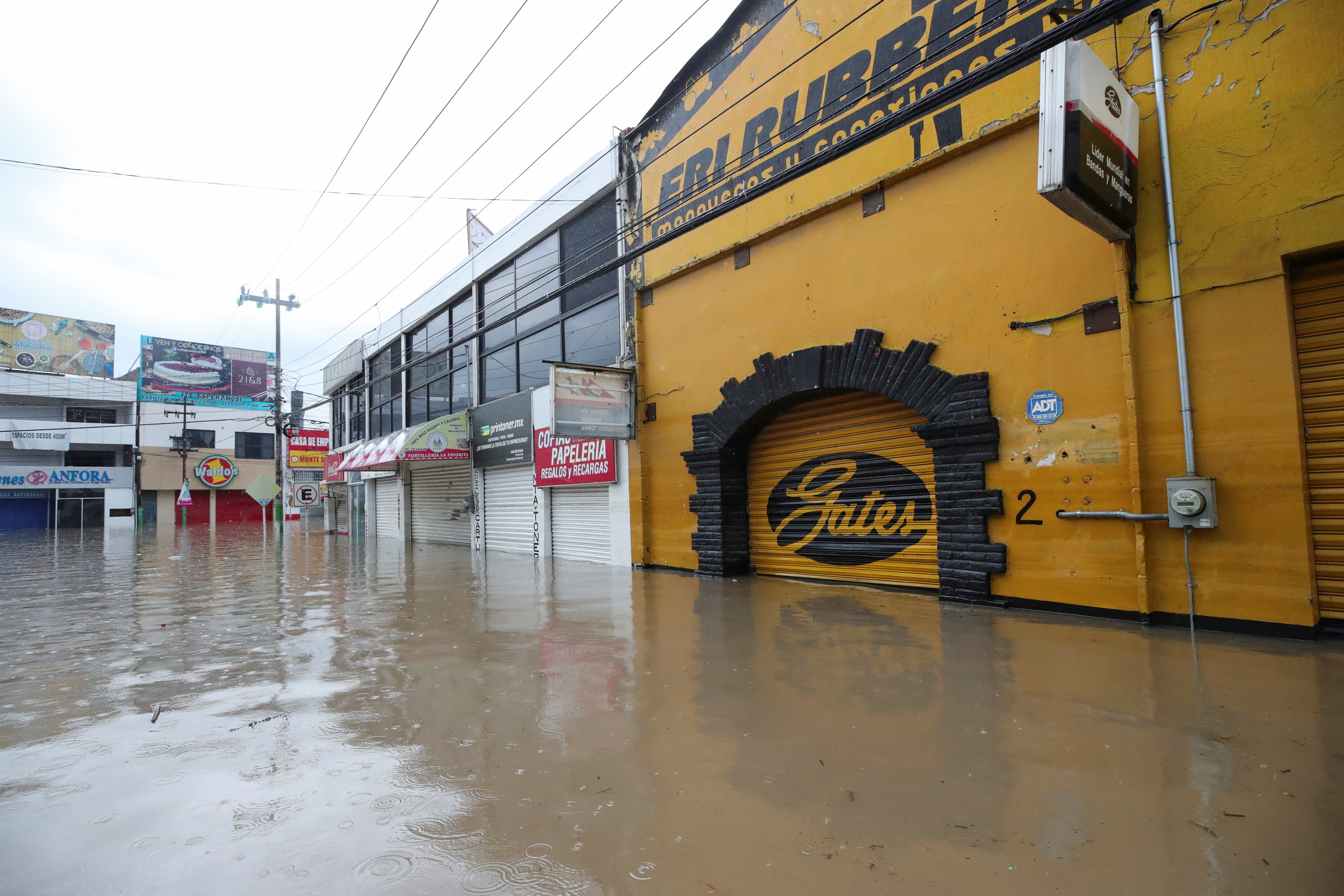 A flooded street is seen after heavy rainfall during Monday's night that left people dead, injured and damaged cars and infrastructure, in Tula de Allende, on the outskirts of Mexico City, Mexico September 7, 2021. REUTERS/Henry Romero