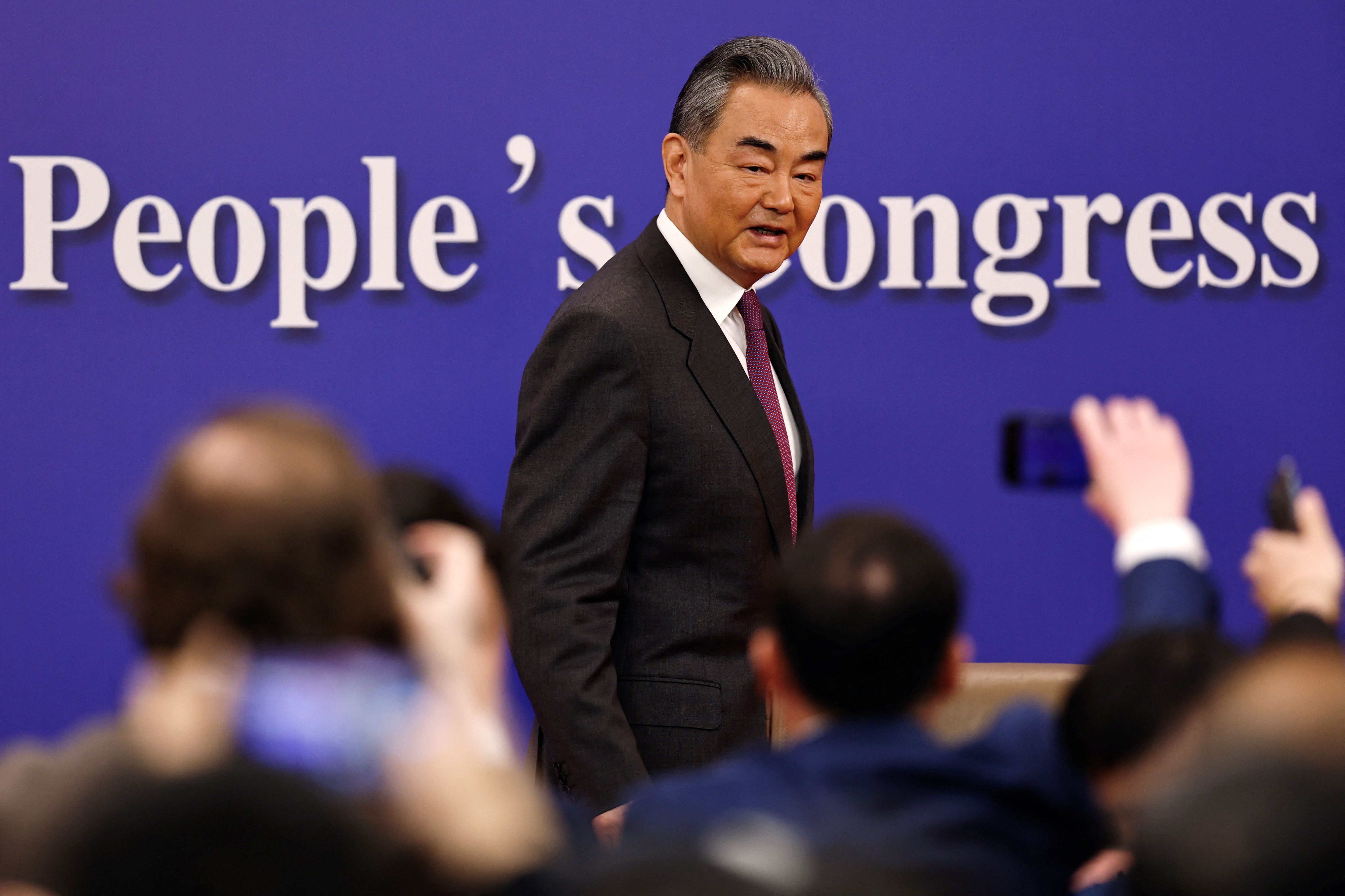 Chinese Foreign Minister Wang Yi attends a press conference on the sidelines of the NPC, in Beijing