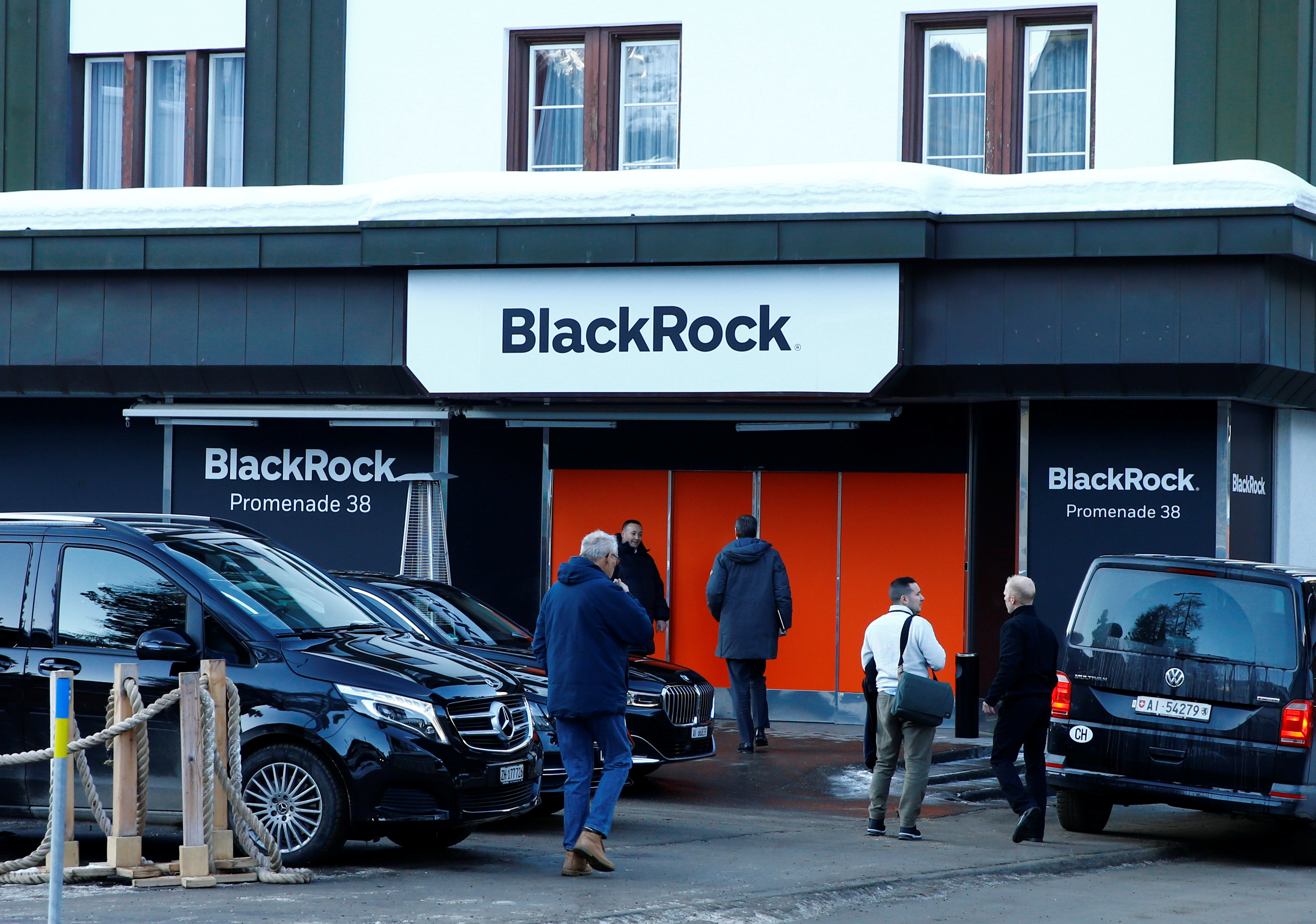 People are seen in front of a showroom that hosts BlackRock in Davos, Switzerland Januar 22, 2020. REUTERS/Arnd Wiegmann