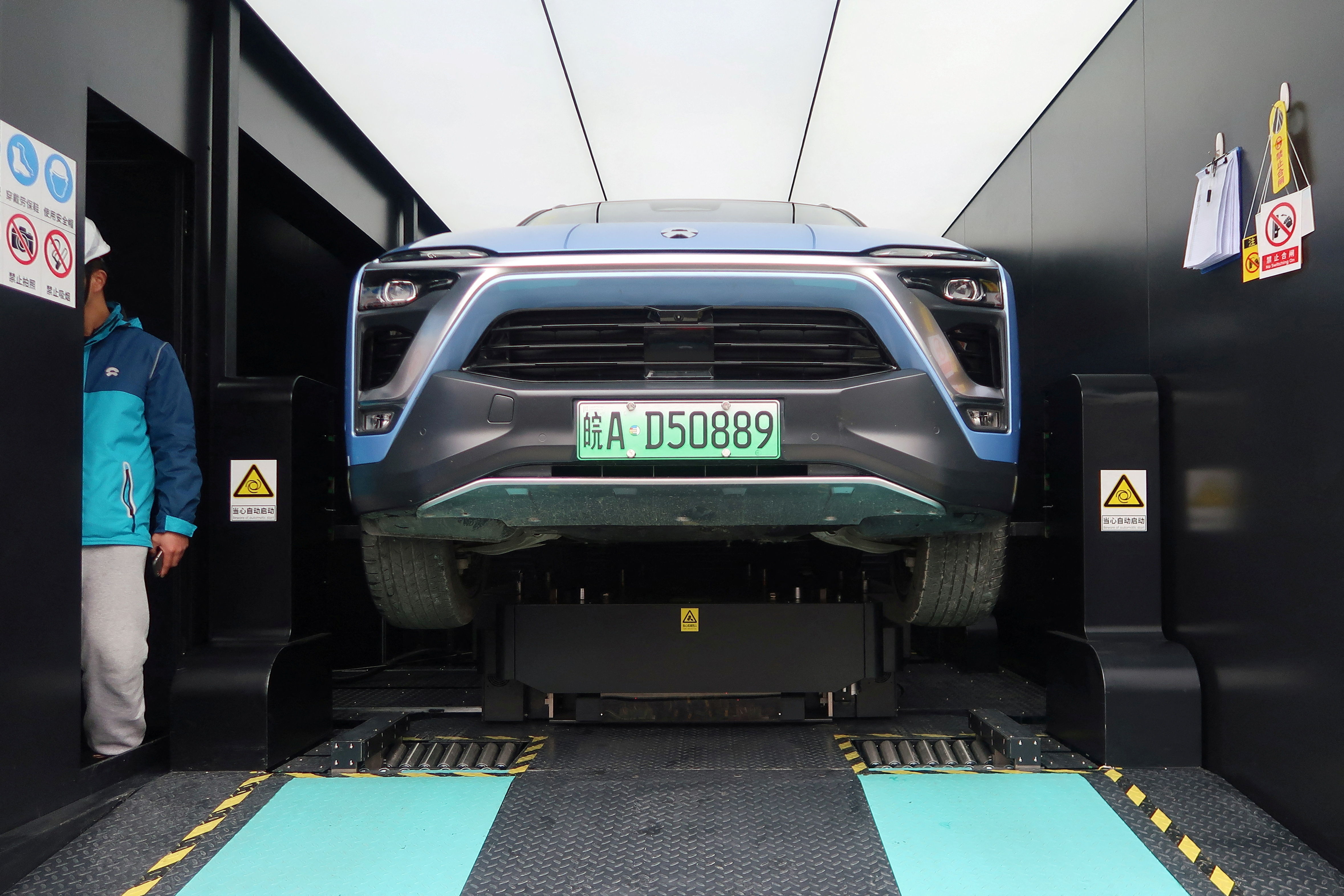 Nio ES8 electric SUV changing its battery is seen inside a power station at a JAC Motors-NIO plant in Hefei