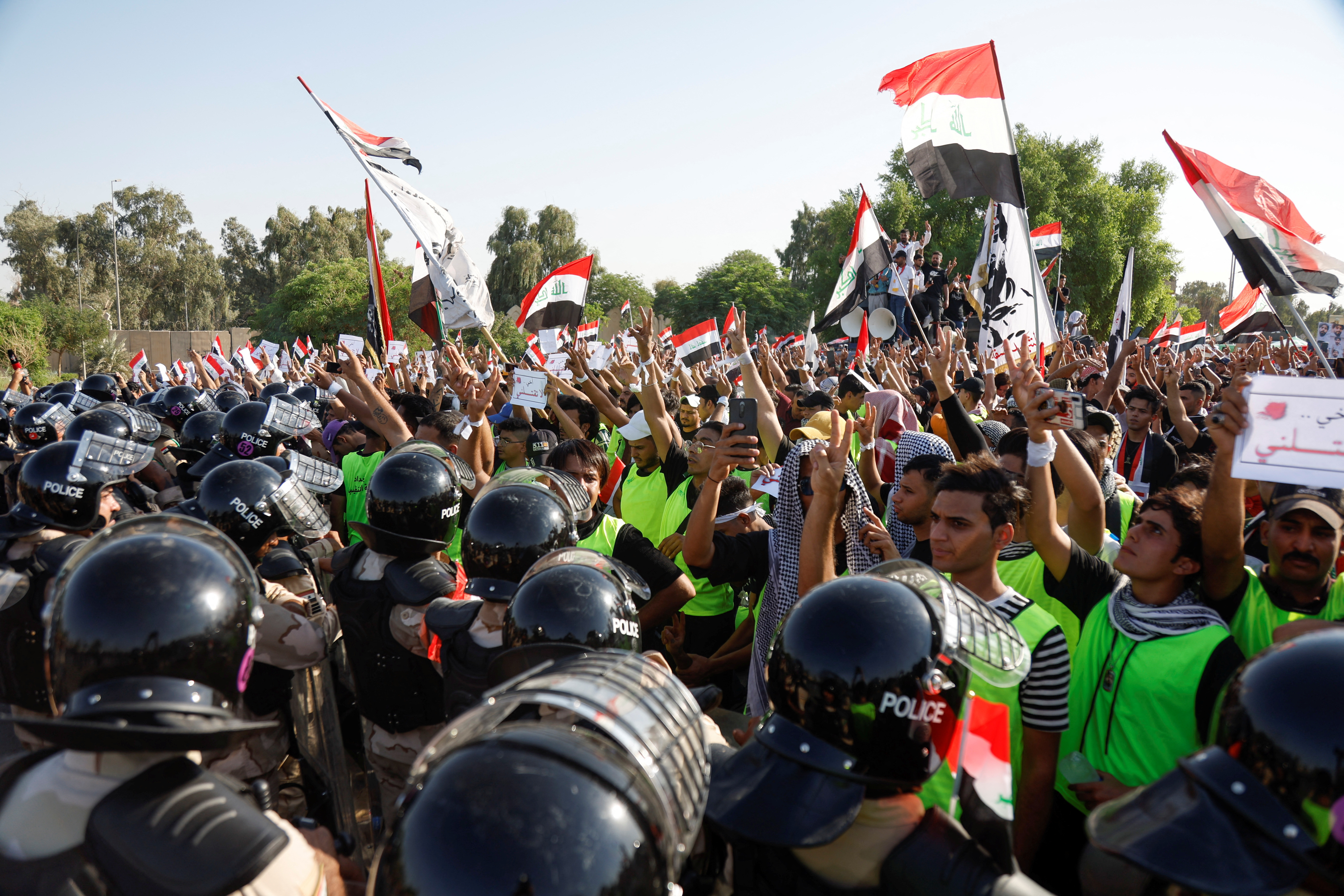 Protestors gather to mark the third anniversary of the anti-government protests in Baghdad