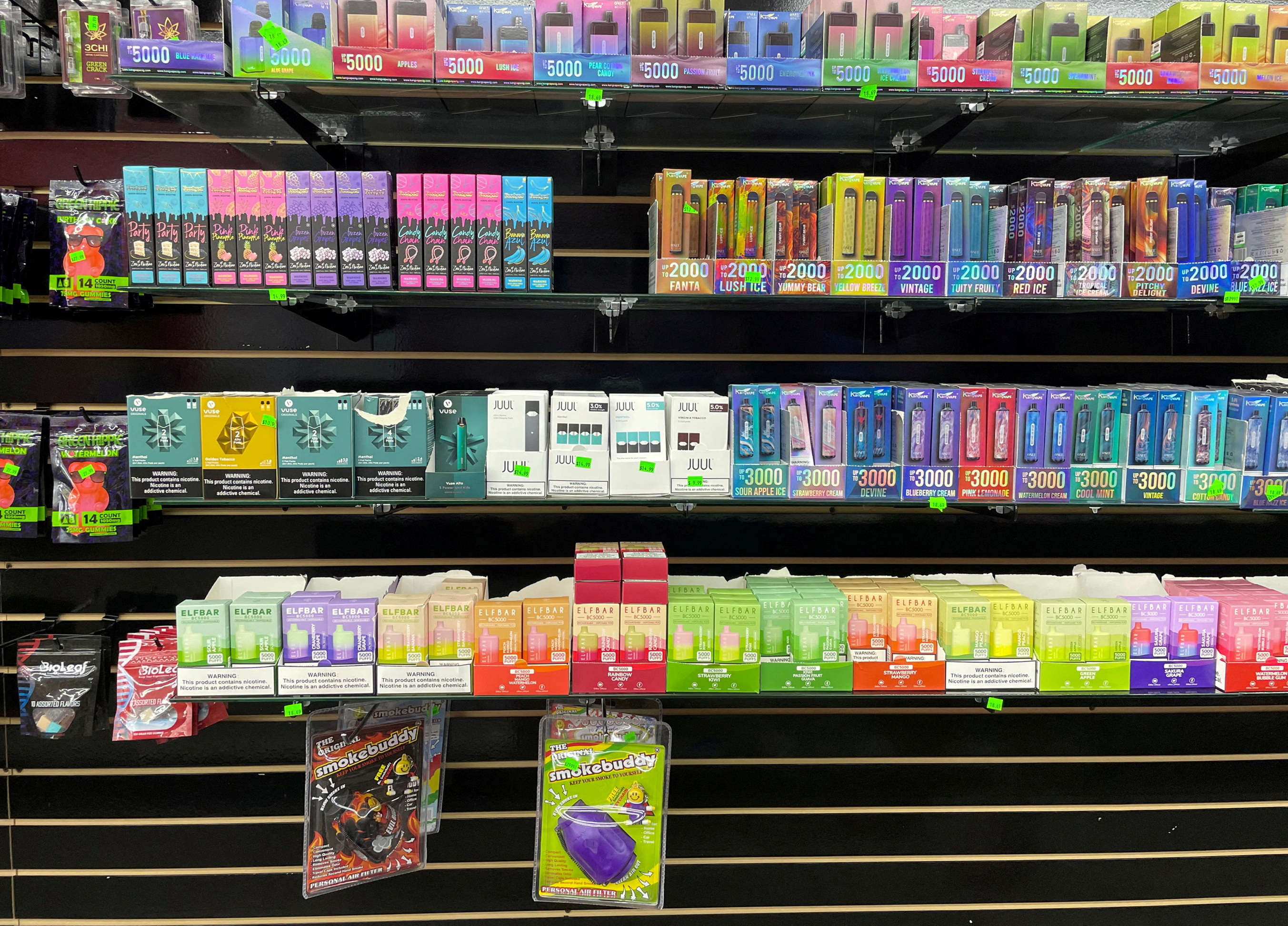 FILE PHOTO: A wall of flavored e-cigarettes in a store in Raleigh