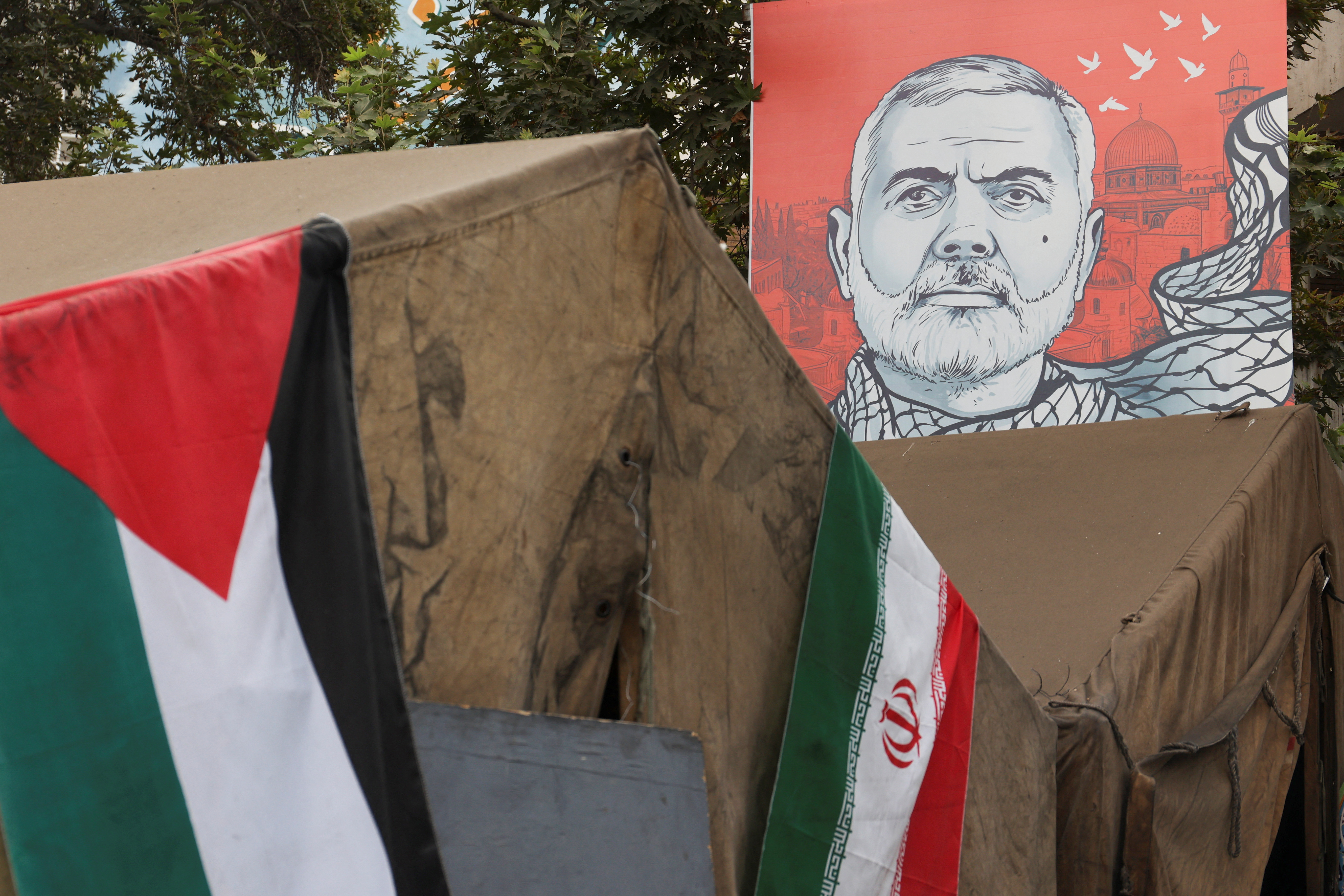 A banner with a picture of late Hamas leader Ismail Haniyeh is displayed in Tehran