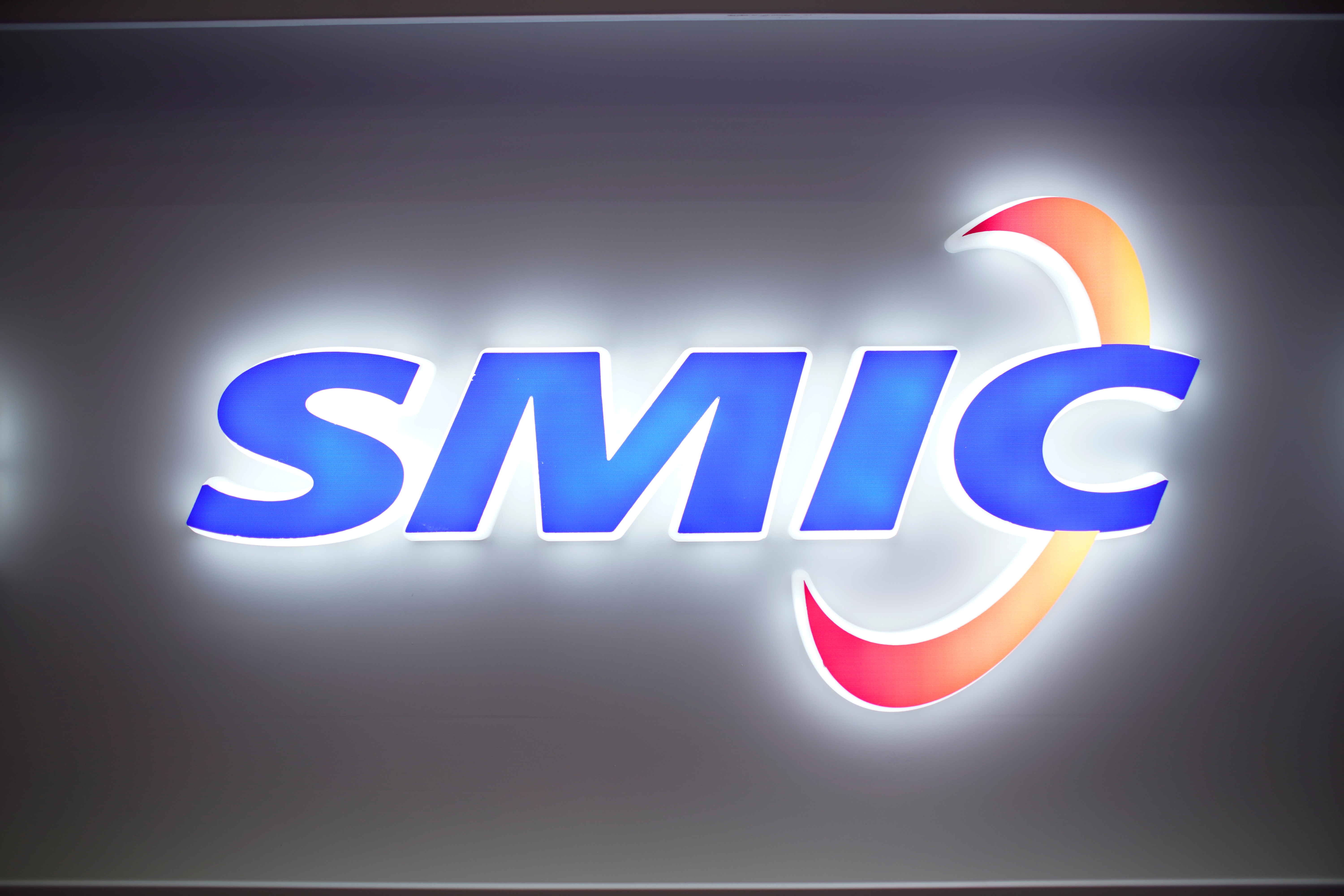 A logo of Semiconductor Manufacturing International Corporation (SMIC) is seen at China International Semiconductor Expo (IC China 2020) in Shanghai, China October 14, 2020. REUTERS/Aly Song/File Photo