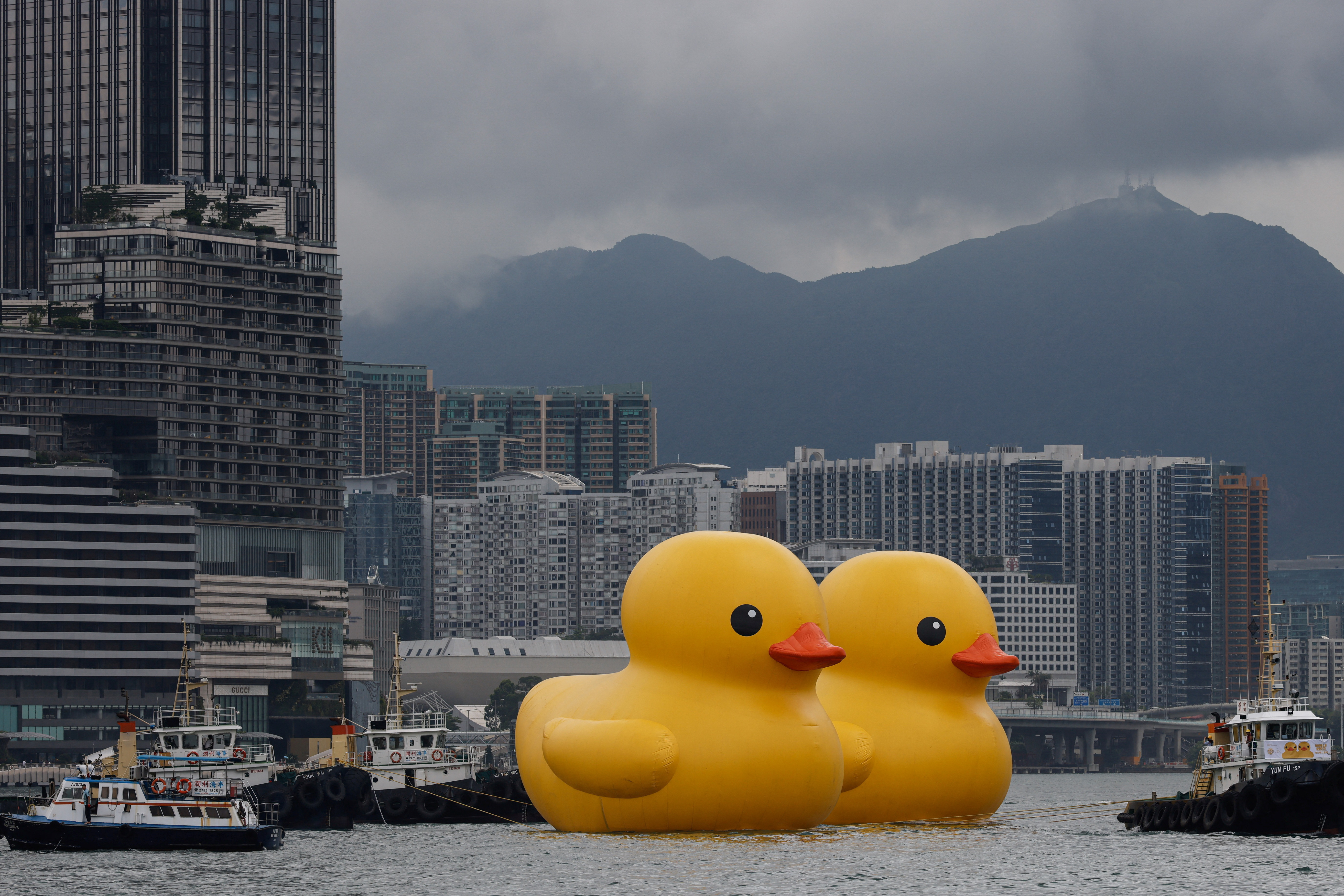 An art installation dubbed "Double Ducks" by Dutch artist Florentijn Hofman, is seen at Victoria Harbour, in Hong Kong