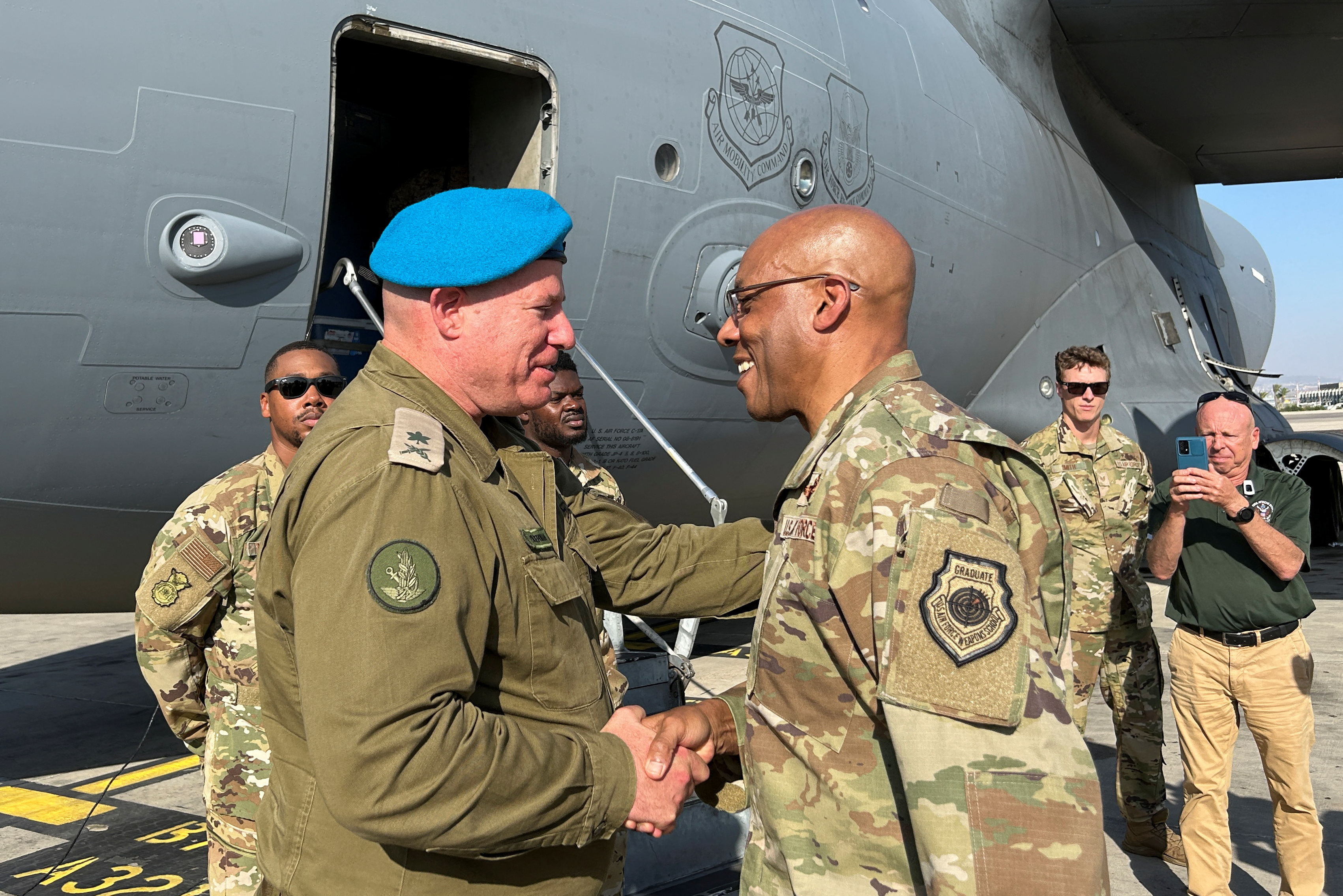 U.S. Air Force General Charles Q. Brown Jr. is greeted by an Israeli military official, at Ben Gurion International Airport outside Tel Aviv