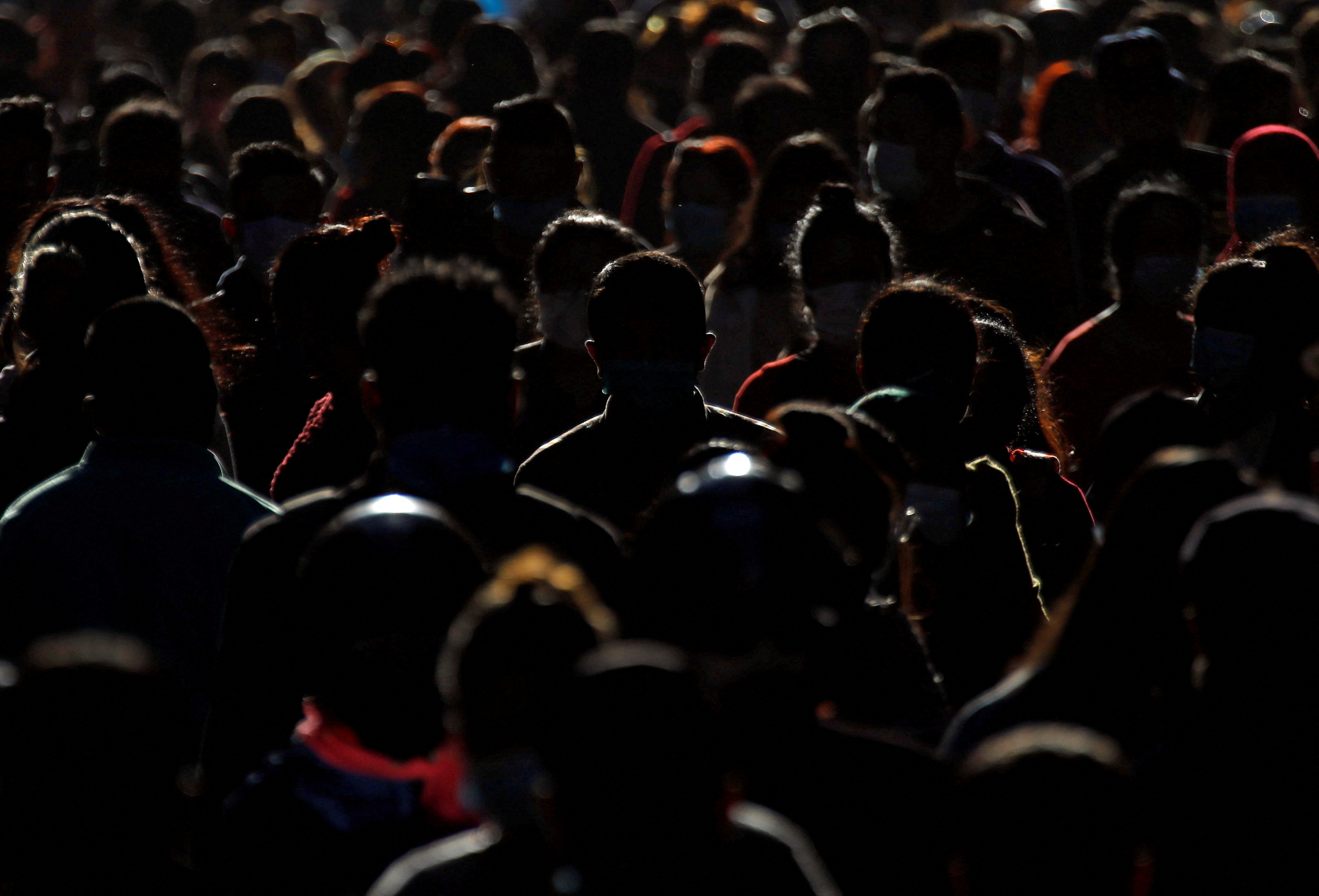 Shoppers crowd a market at Ashon, during Tihar festival, also called Diwali, in Kathmandu