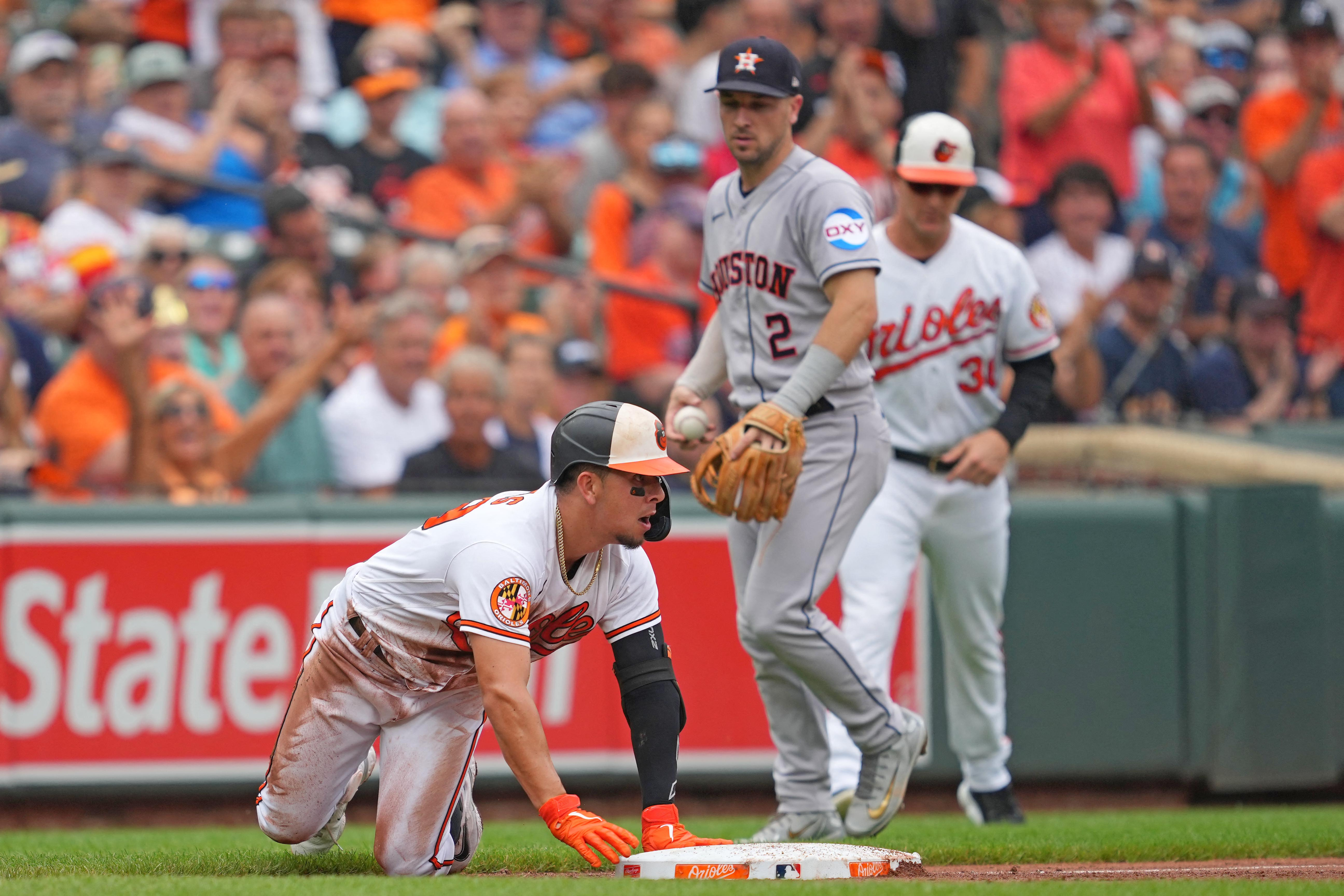 Baltimore Orioles pitcher Dean Kremer, right, is congratulated by catcher  Adley Rutschman after pitching a 6-0 shutout against the Houston Astros in  a baseball game, Friday, Sept. 23, 2022, in Baltimore. (AP