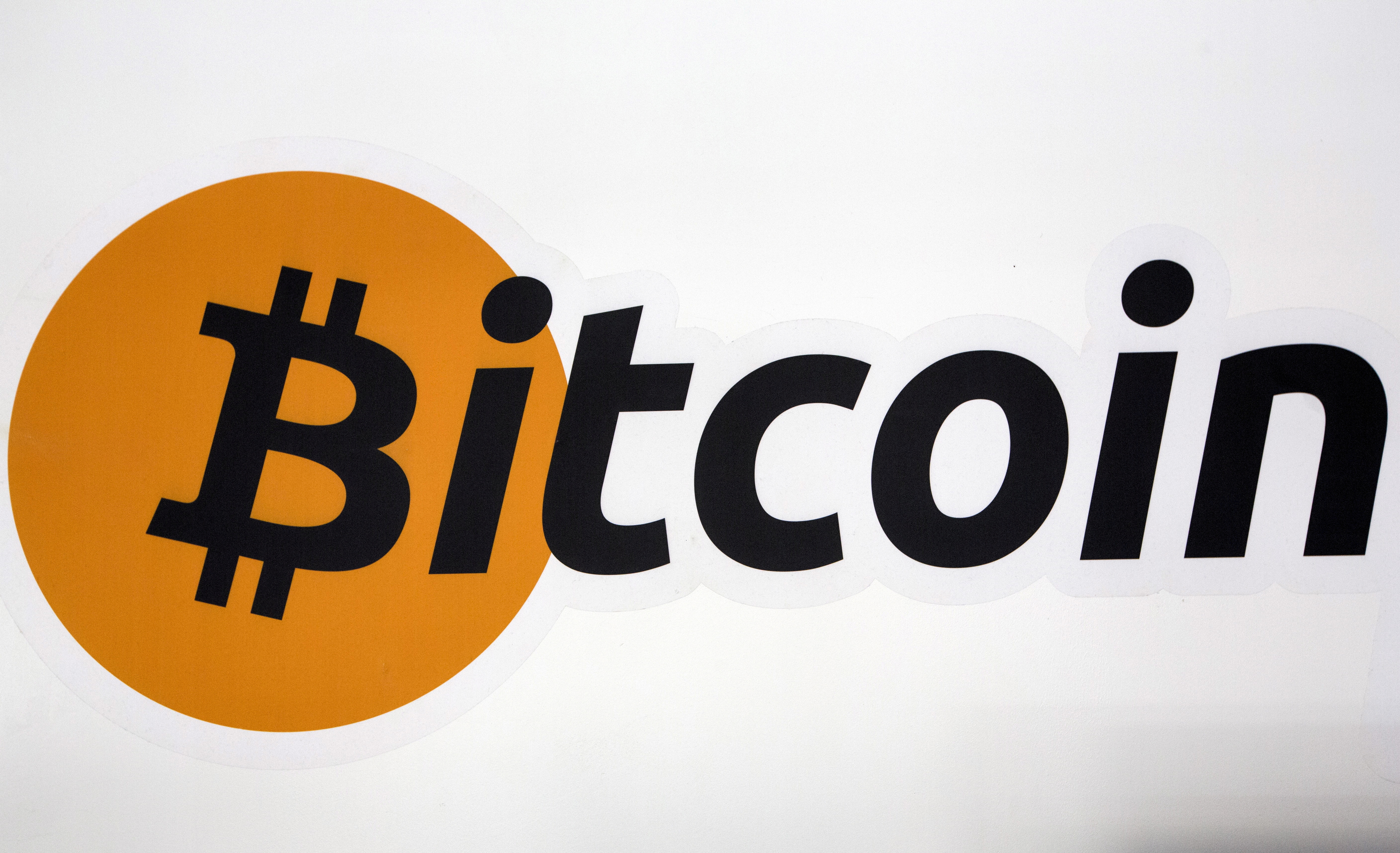 A Bitcoin logo is displayed at the Bitcoin Center New York City in New York's financial district