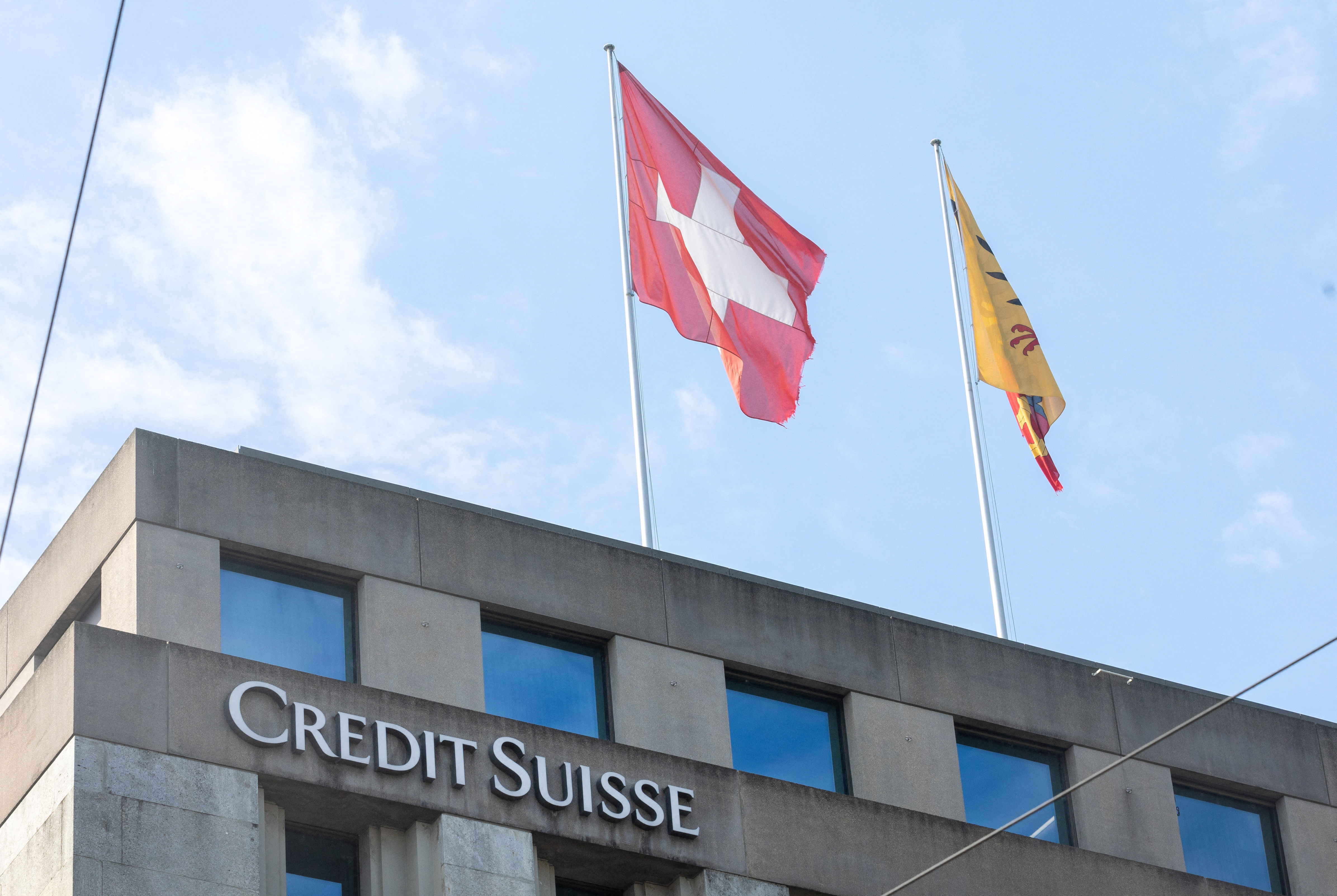 Swiss and Canton de Geneve flags are seen on a building of Swiss bank Credit Suisse in Geneva