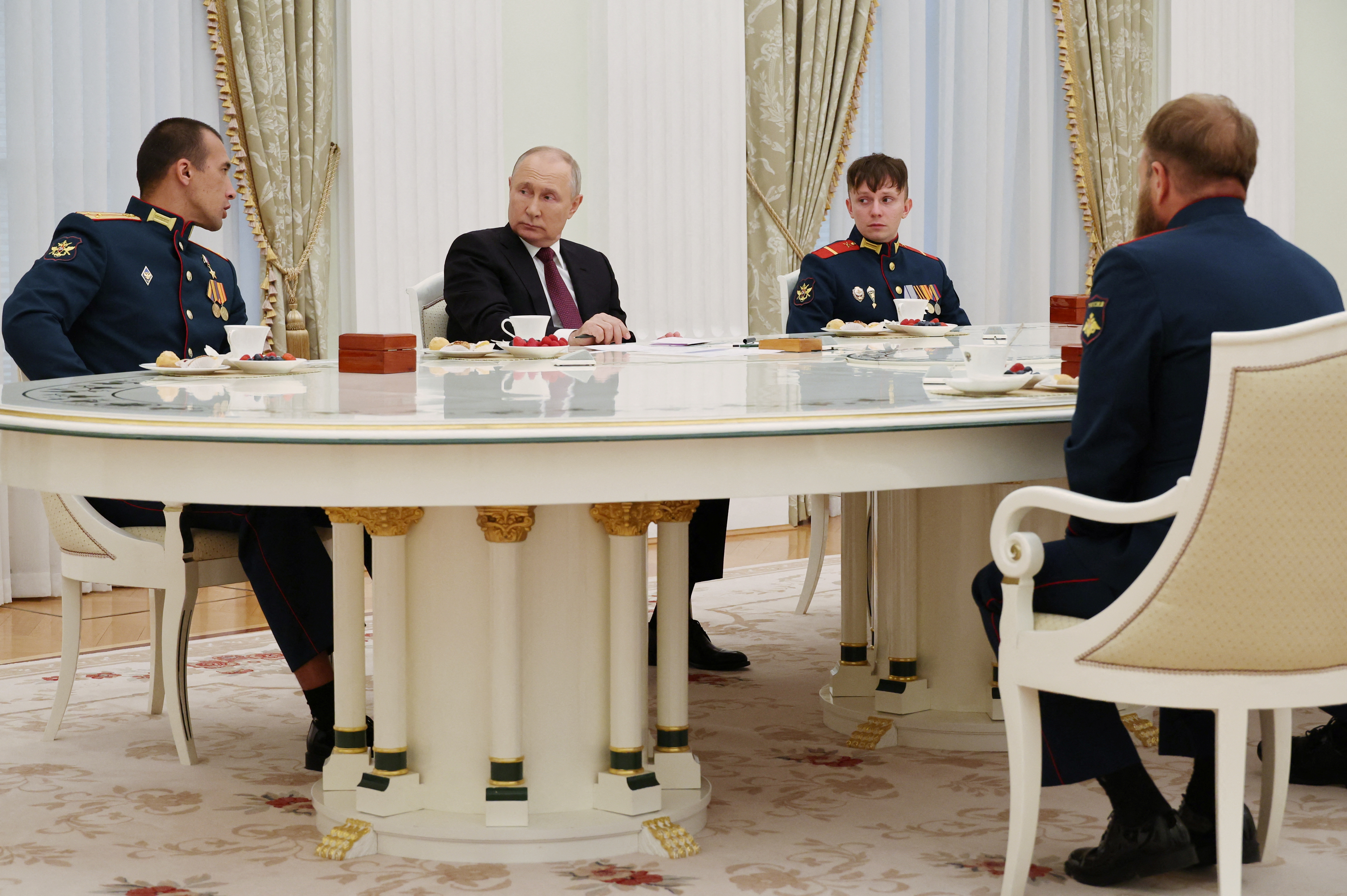 Russian President Putin meets with tank crew in Moscow