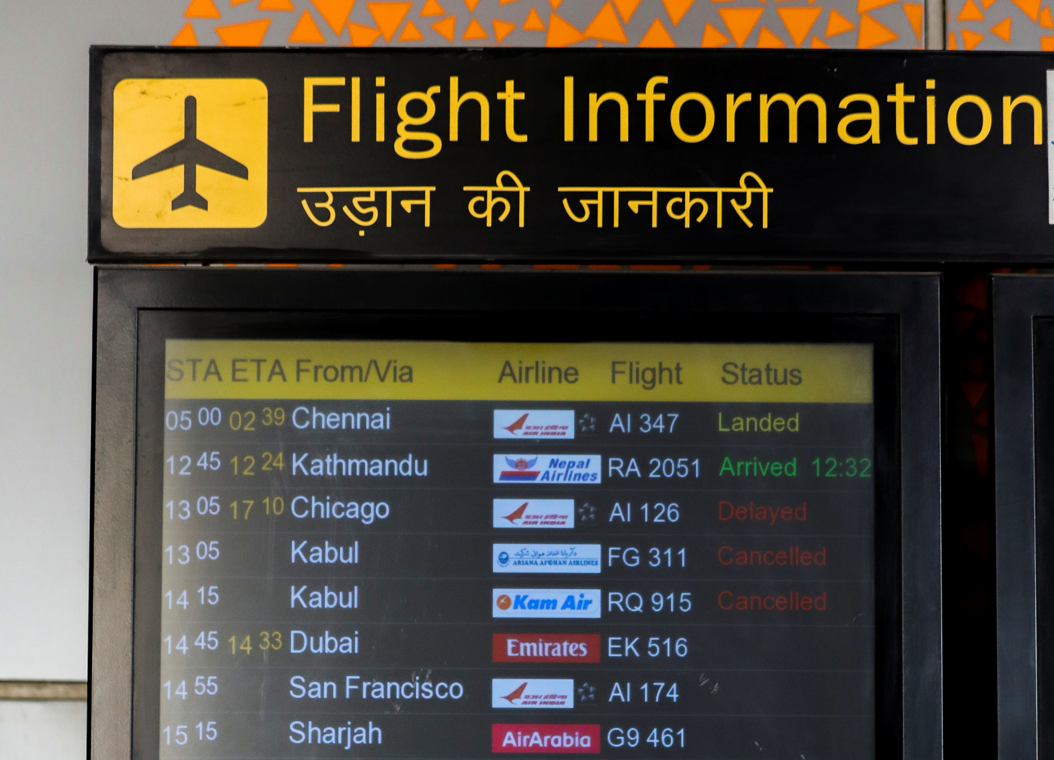 A flight Information board showing flights cancelled from Kabul is pictured at the Indira Gandhi International Airport in New Delhi