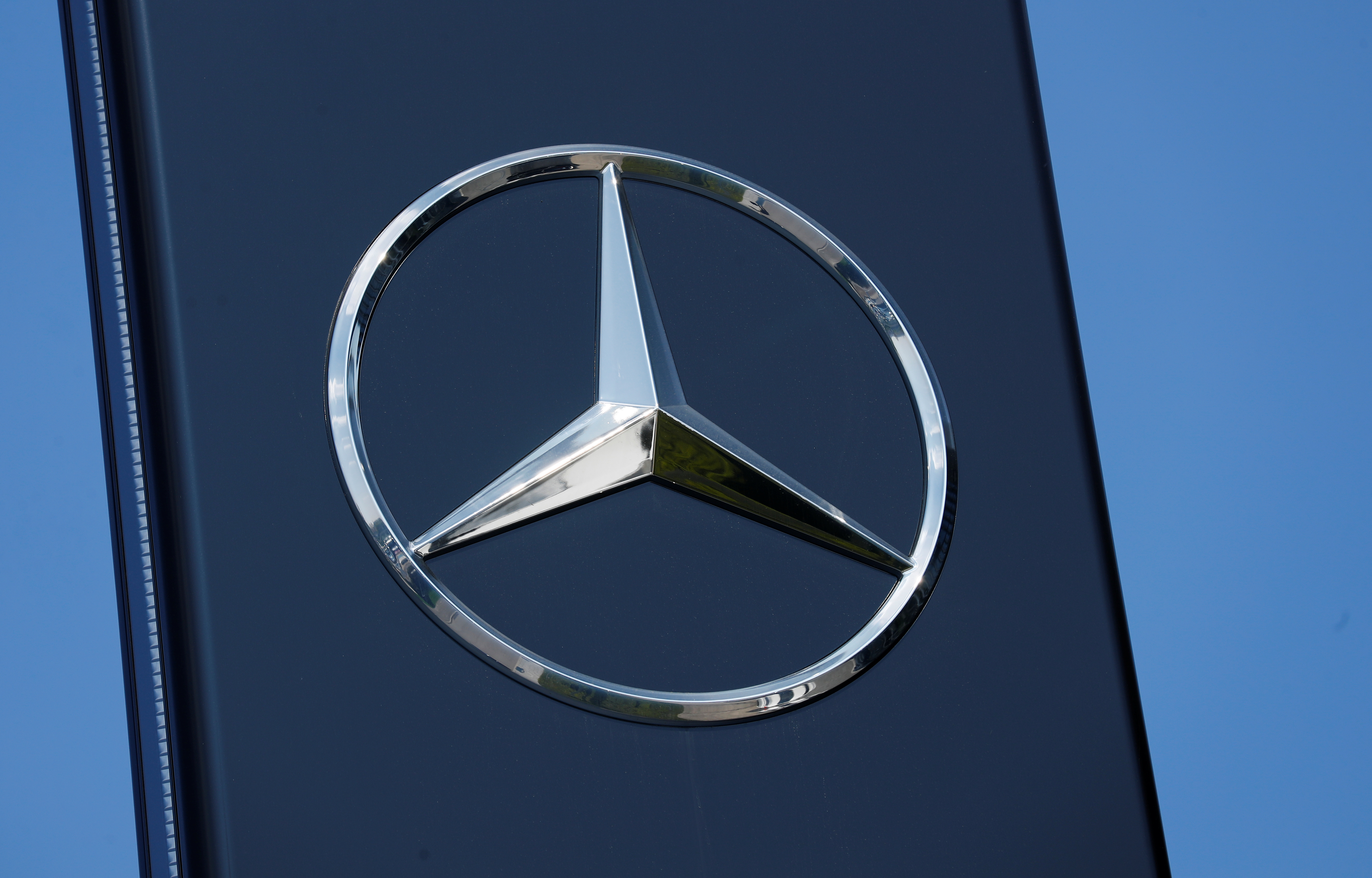 A Mercedes Benz logo is pictured at a Mercedes Benz branch in Stuttgart