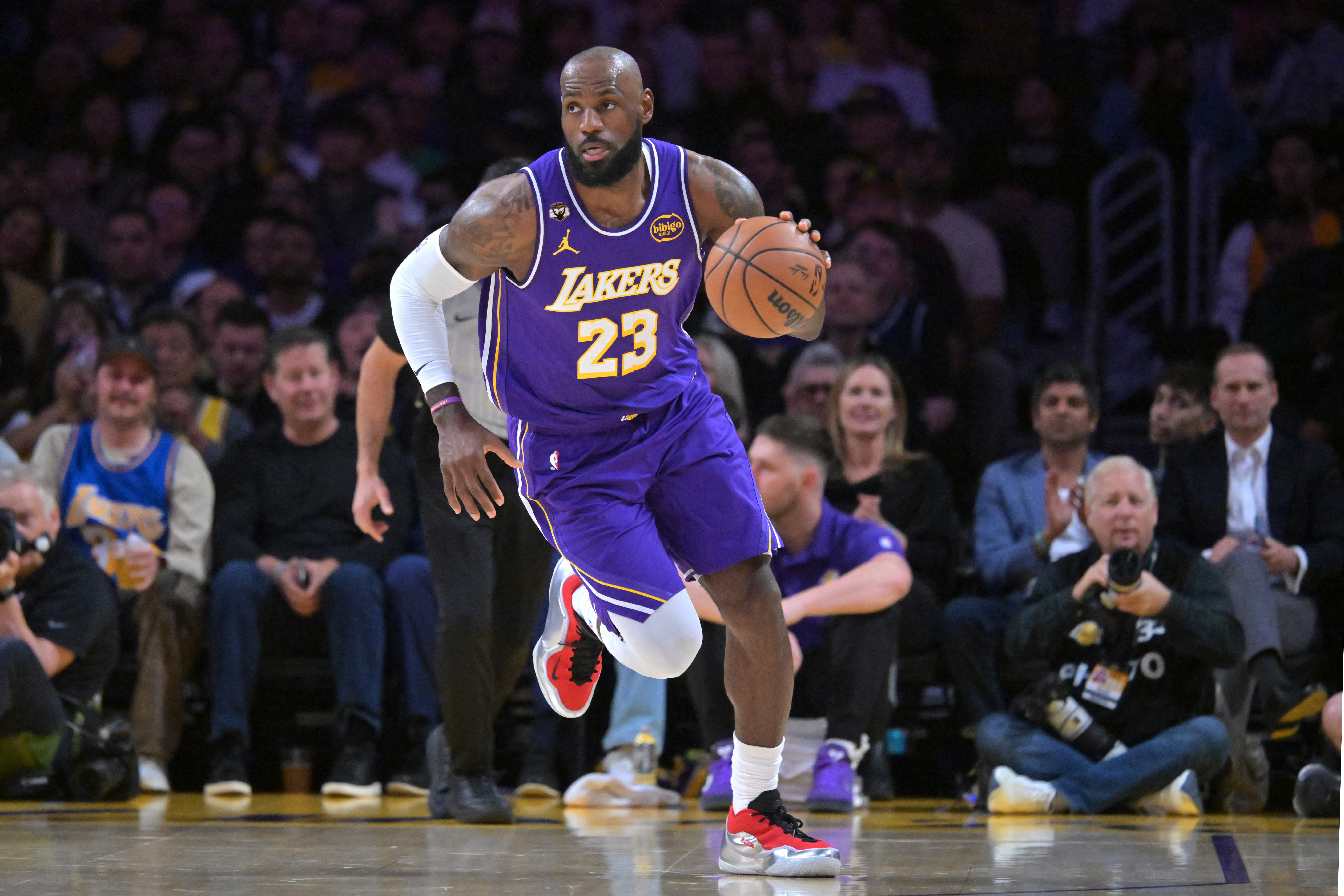 LeBron James makes triple-double history as Lakers top Mavs | Reuters