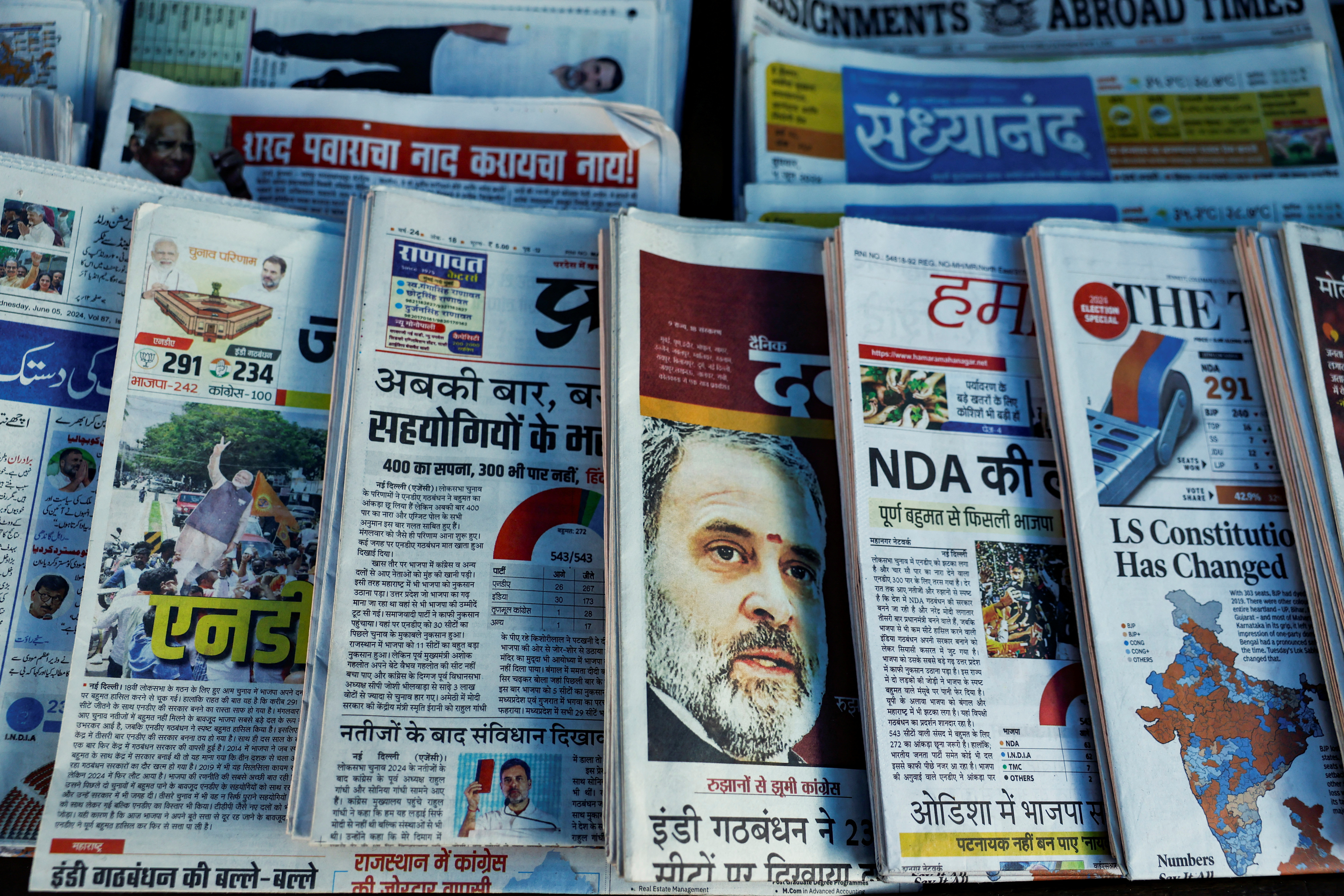 Newspapers are displayed at a stall following the results of India's general election, in Mumbai